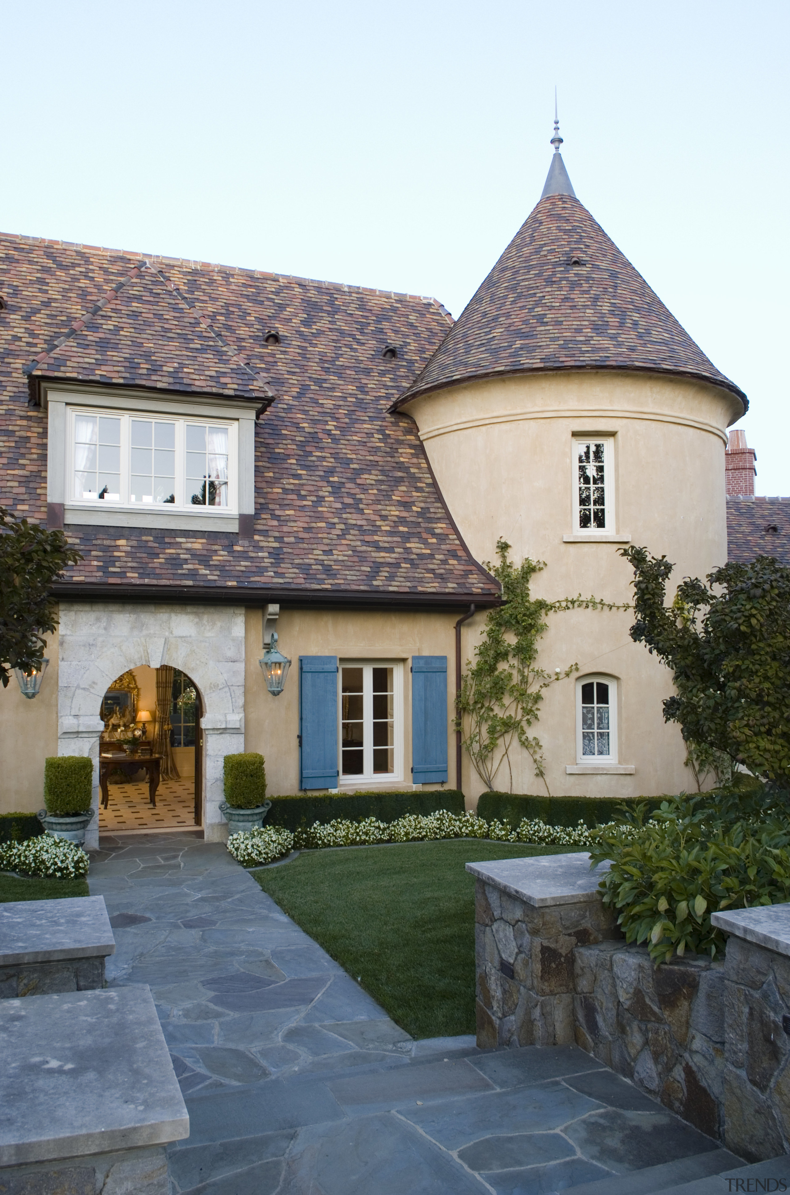 View of house, clay tile roof, cement plaster building, cottage, estate, facade, home, house, mansion, property, real estate, roof, sky, villa, window, gray, white