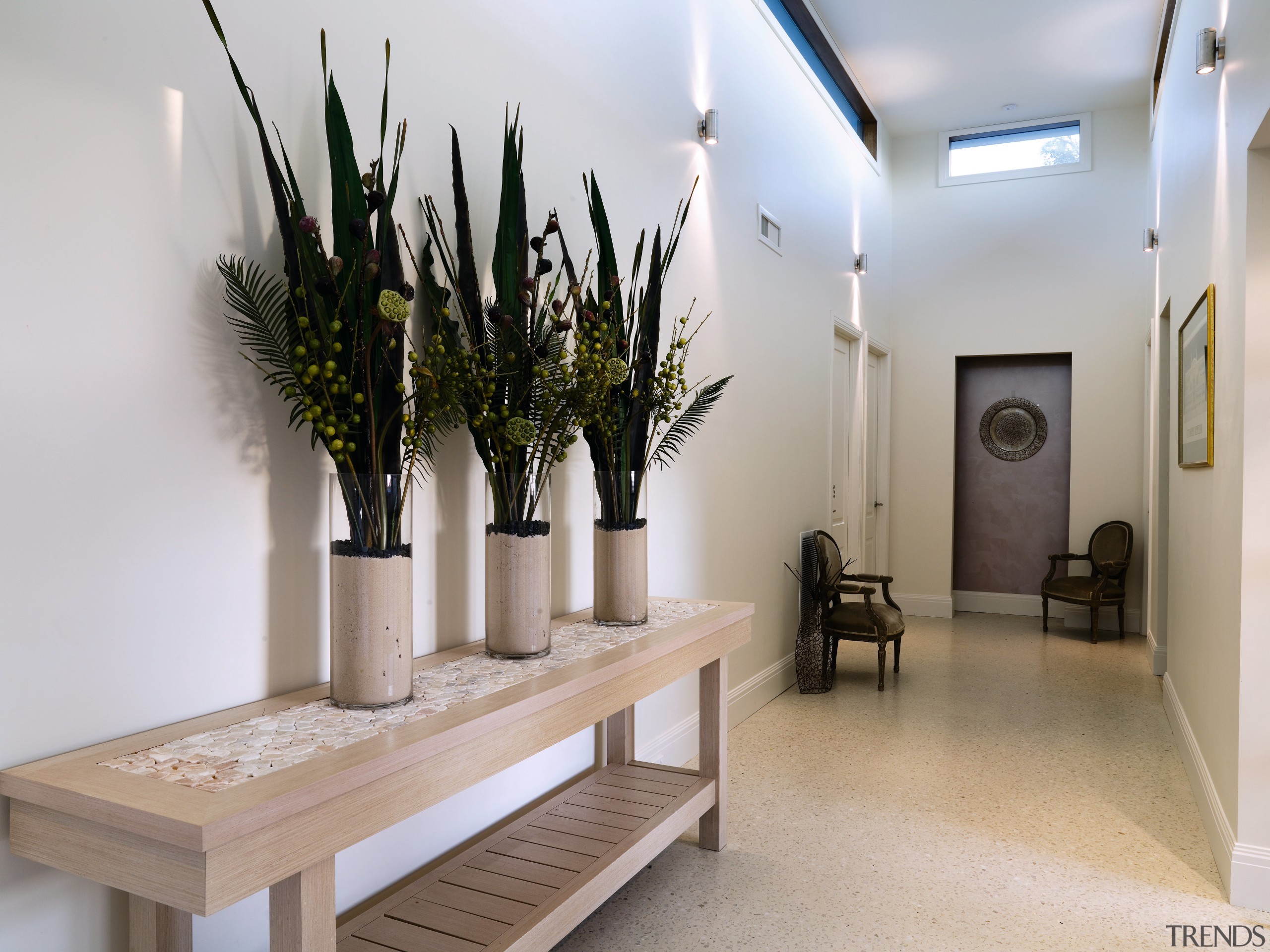 A view of this hallway featuring  tiled floor, flooring, furniture, interior design, gray