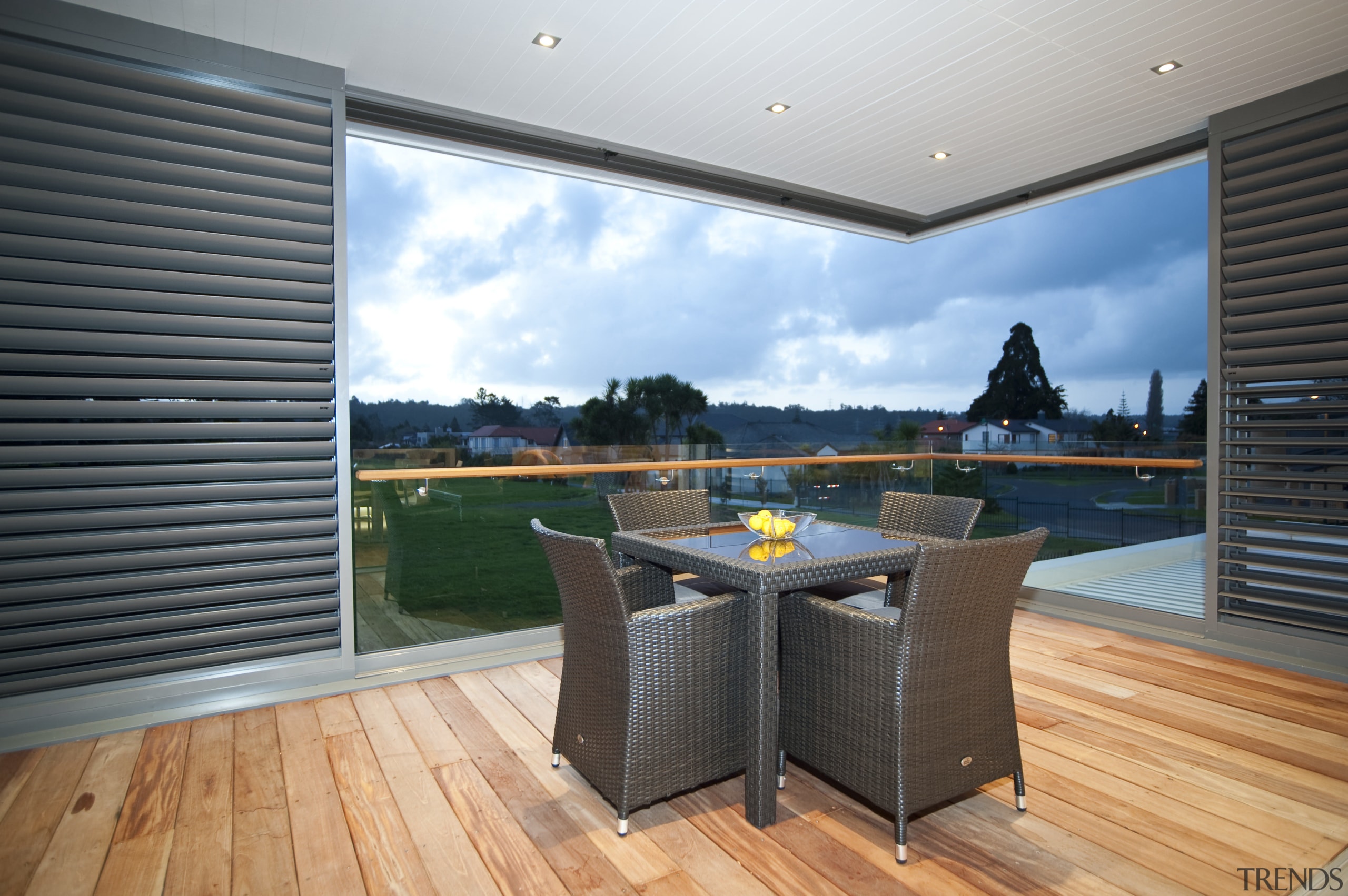 interior deck View of Oak Manor.Motorized opening slides apartment, floor, hardwood, home, house, interior design, penthouse apartment, property, real estate, wall, window, wood