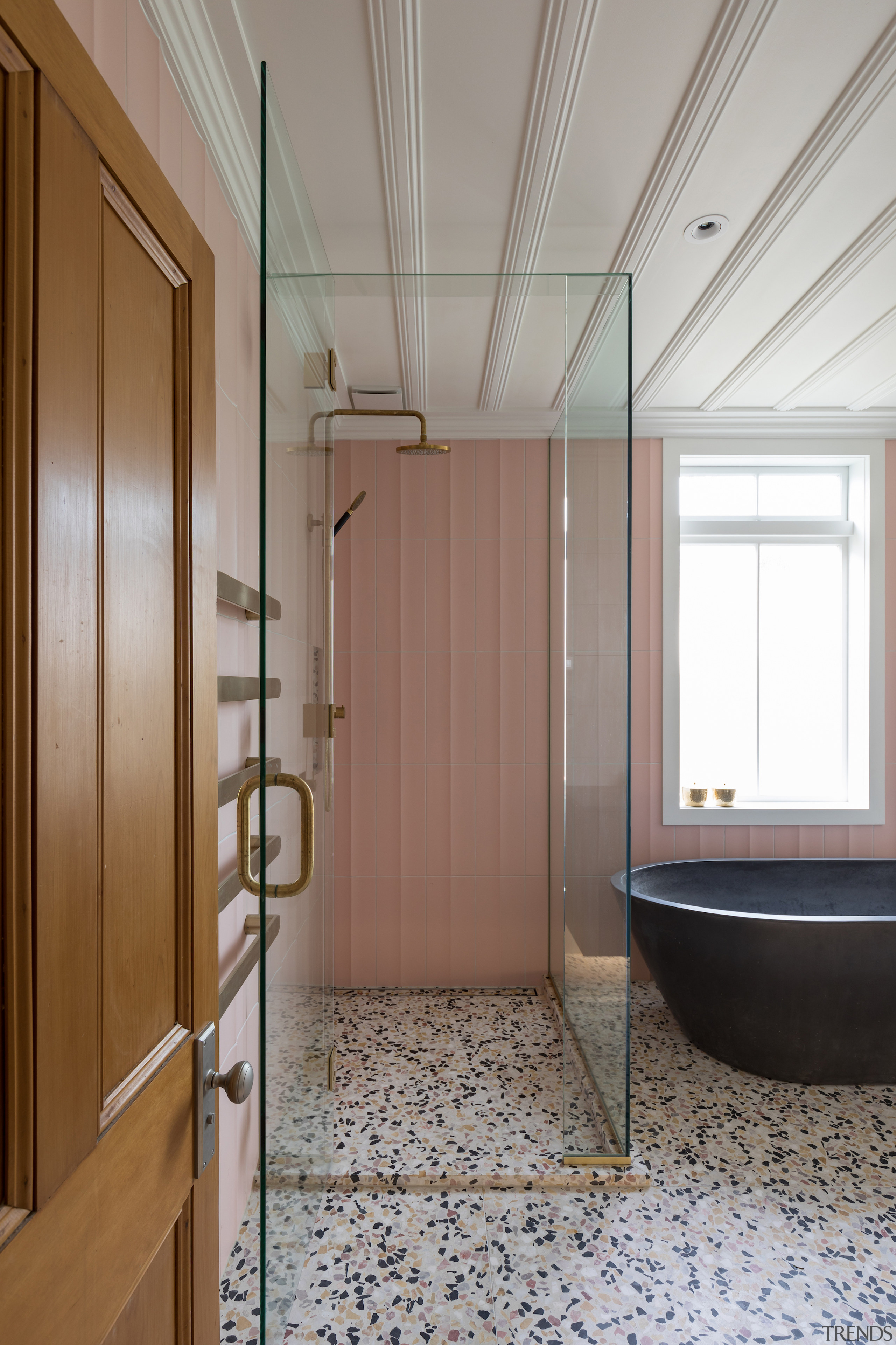 The modern clear glass shower stall adds to 