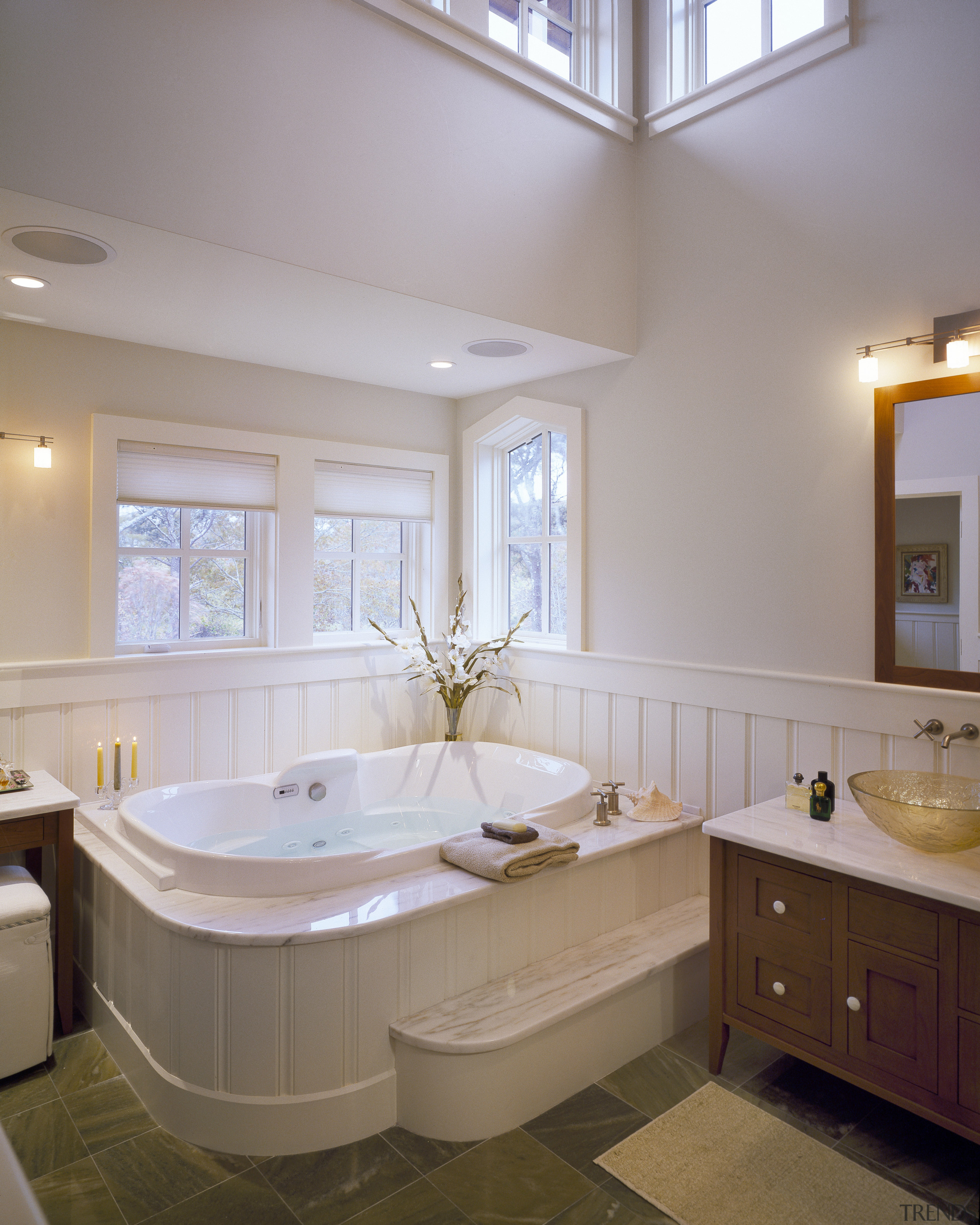 View of light toned bathroom with white oval bathroom, bathtub, ceiling, daylighting, estate, floor, home, interior design, real estate, room, sink, window, gray
