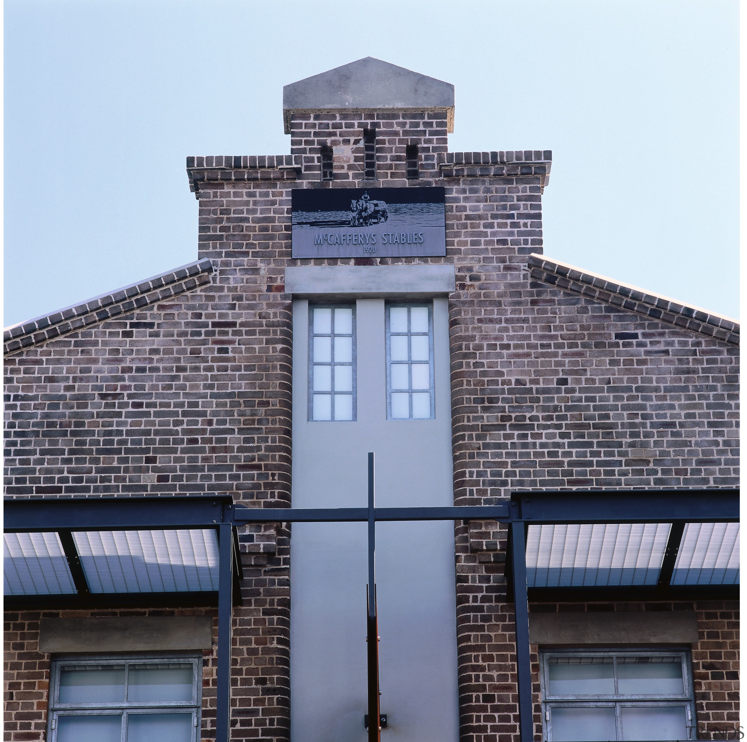 Close up view of the brick building, concrete architecture, brick, brickwork, building, commercial building, daylighting, daytime, facade, house, landmark, residential area, roof, sky, window