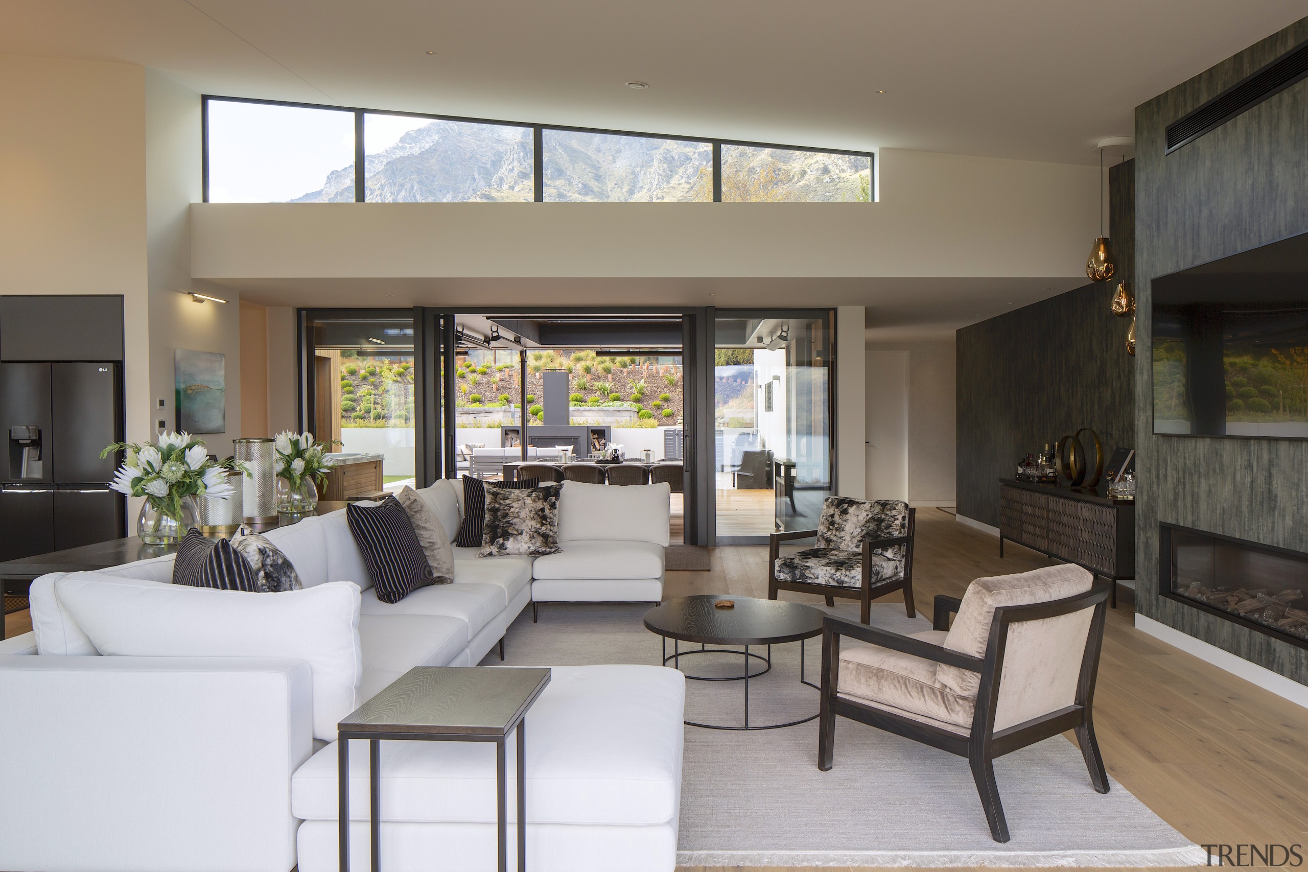 Living area looking to patios one way and 