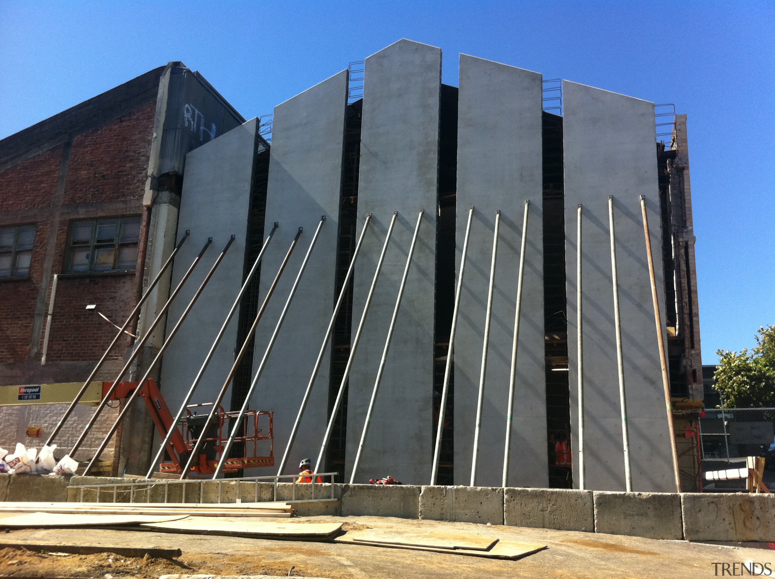 During the strengthening and restoration of Orange Hall, architecture, brutalist architecture, building, commercial building, corporate headquarters, daytime, facade, headquarters, landmark, metropolitan area, structure, gray, black