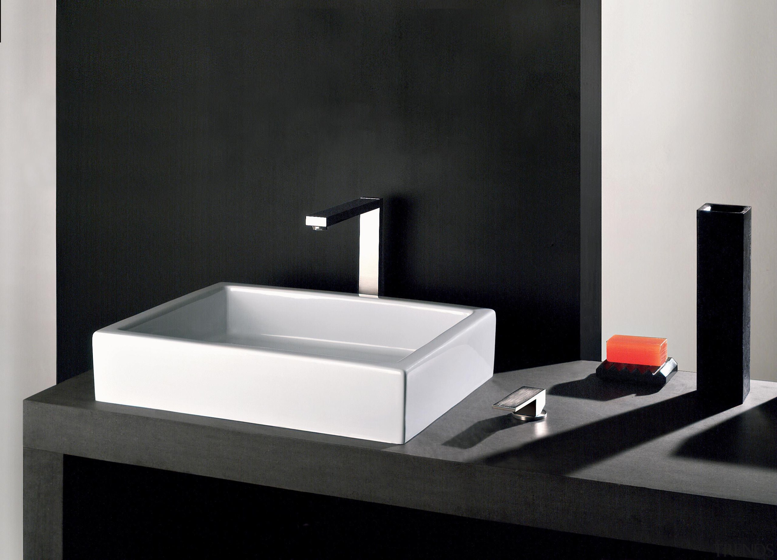 With its iconic rectangular shape, the Rettangolo collection bathroom, bathroom sink, plumbing fixture, product, product design, sink, tap, black, white
