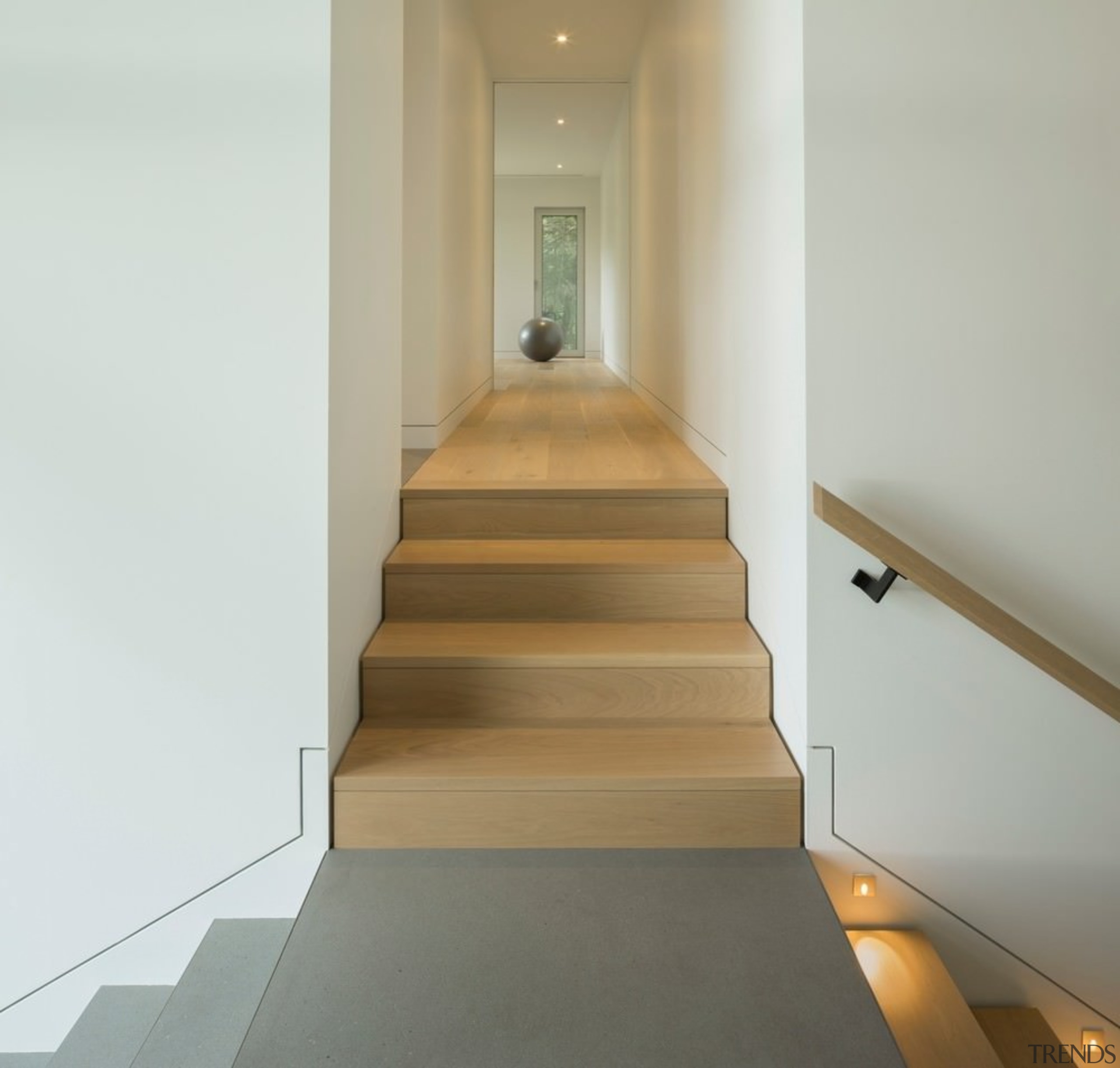 Two staircases meet at this junction before merging floor, flooring, handrail, hardwood, interior design, laminate flooring, property, stairs, wood, wood flooring, gray, white