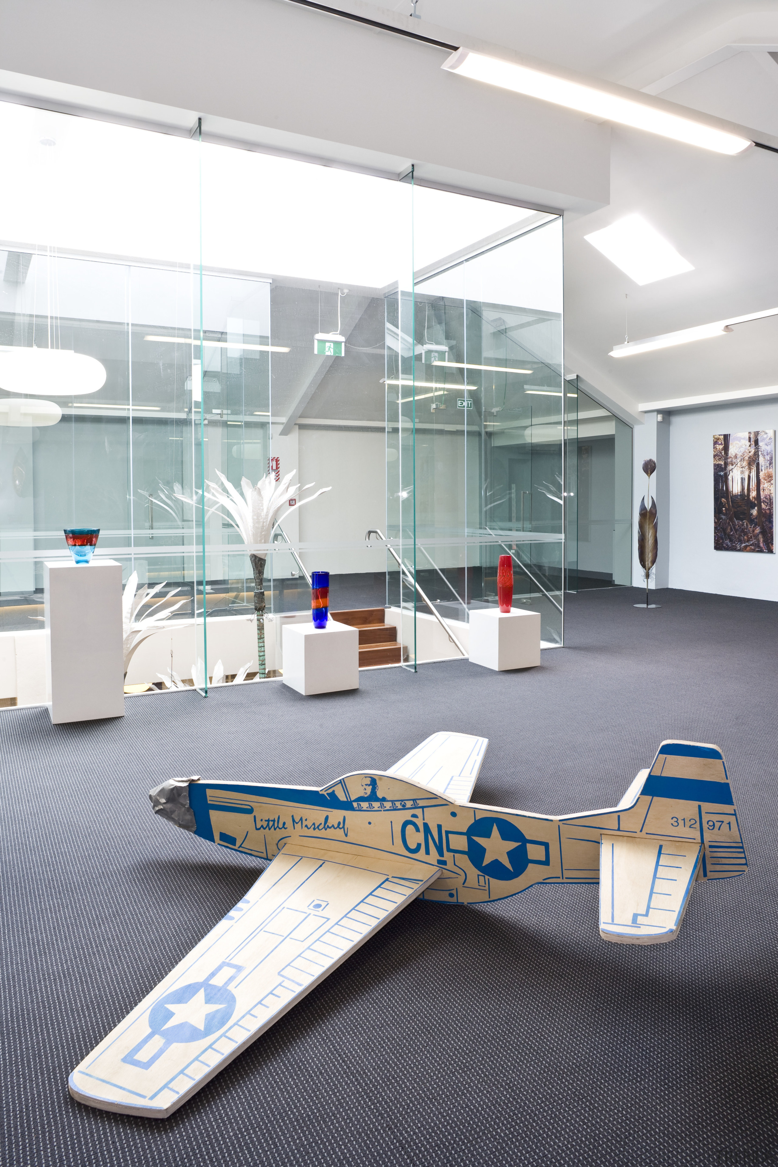 View of a gallery space on the mezzanine floor, furniture, glass, interior design, product design, table, gray, white