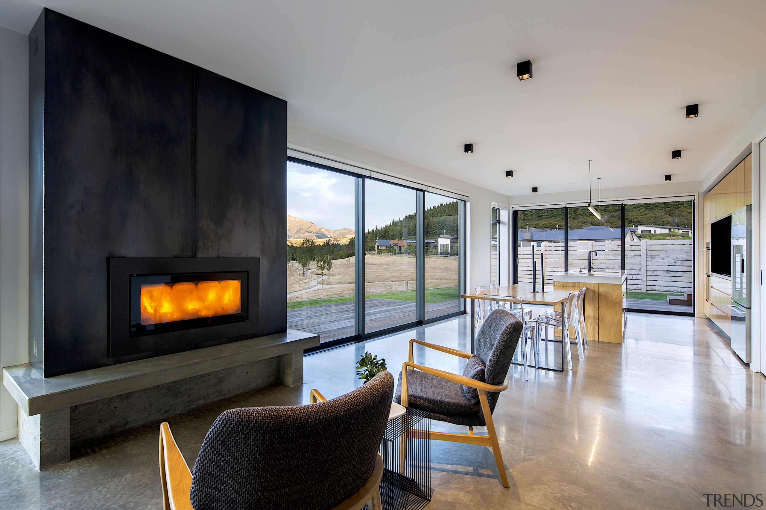 A built-in log fire contributes to the heating gray, black