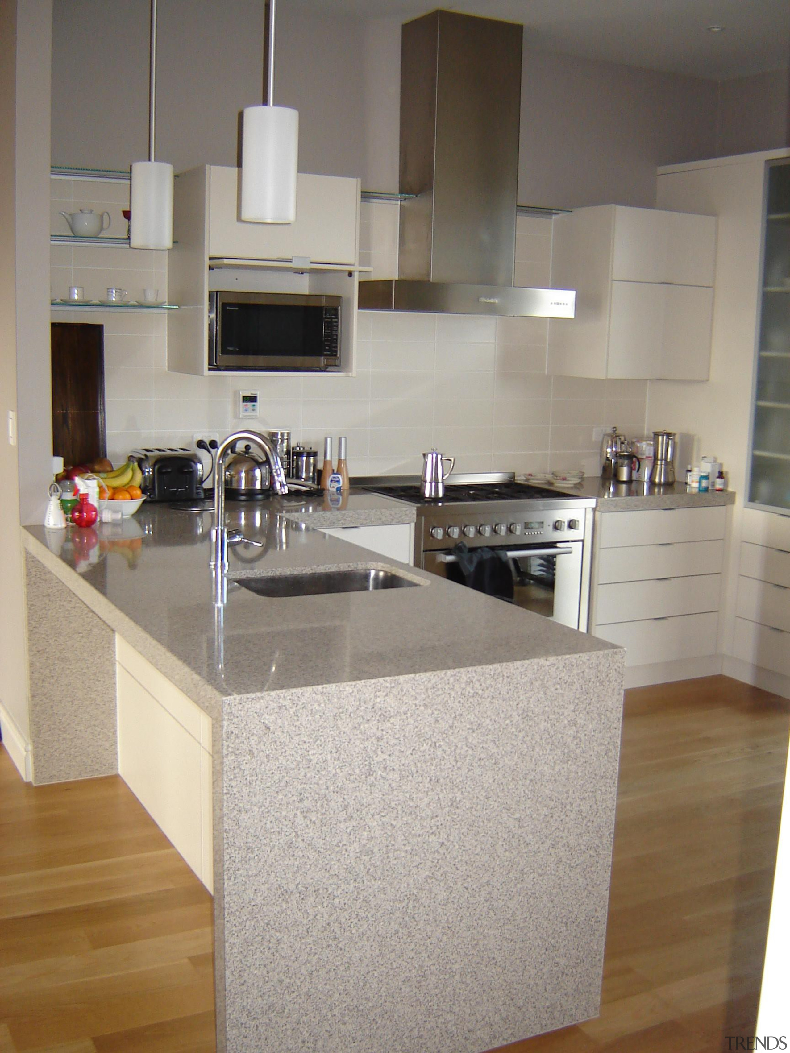 Kitchen in a generously proportioned plaster home built cabinetry, countertop, cuisine classique, floor, flooring, hardwood, interior design, kitchen, laminate flooring, room, wood flooring, gray