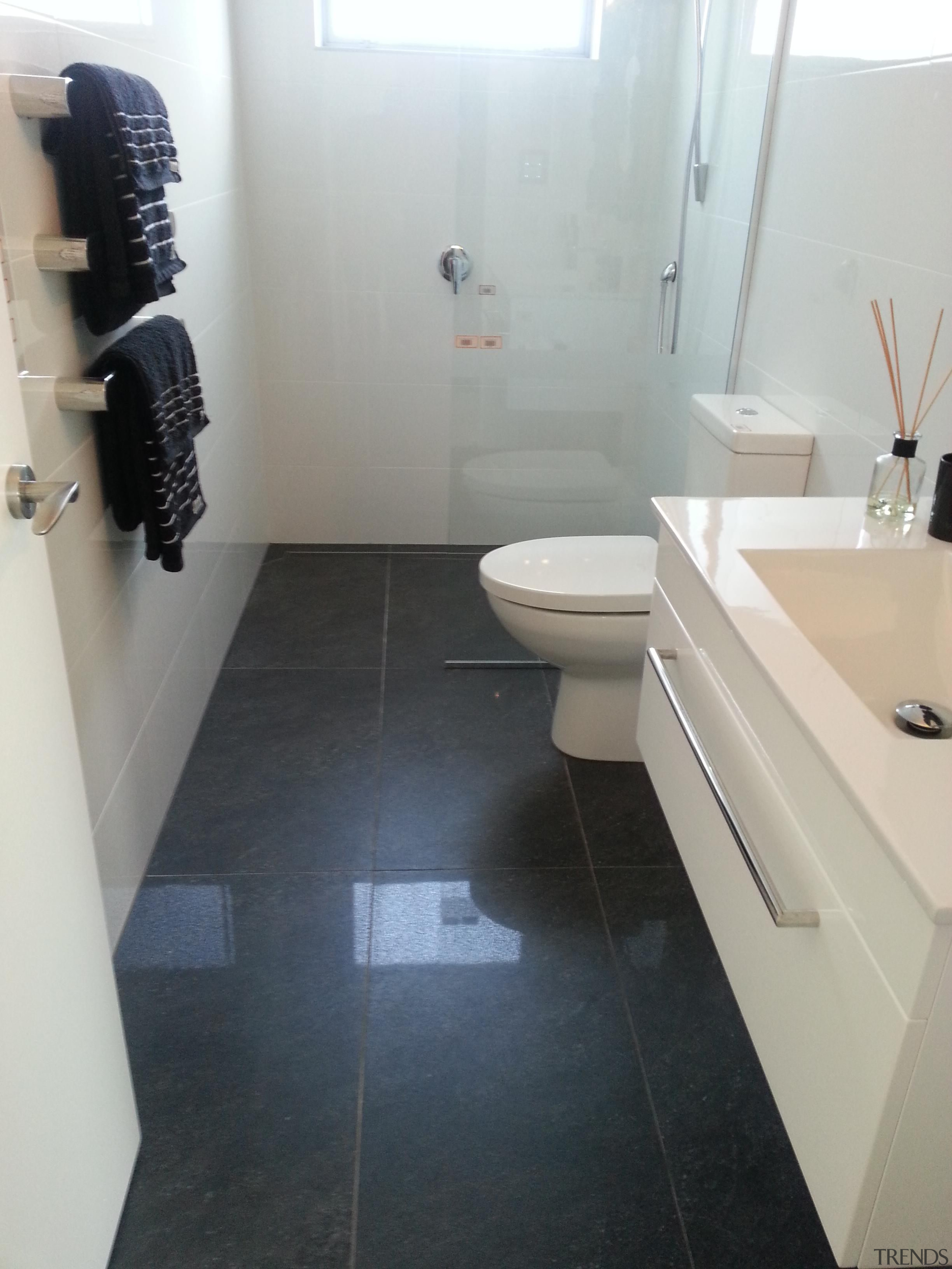 Anthracite bathroom floor and Easy White Gloss wall. bathroom, floor, flooring, hardwood, interior design, plumbing fixture, property, room, sink, tile, gray, black