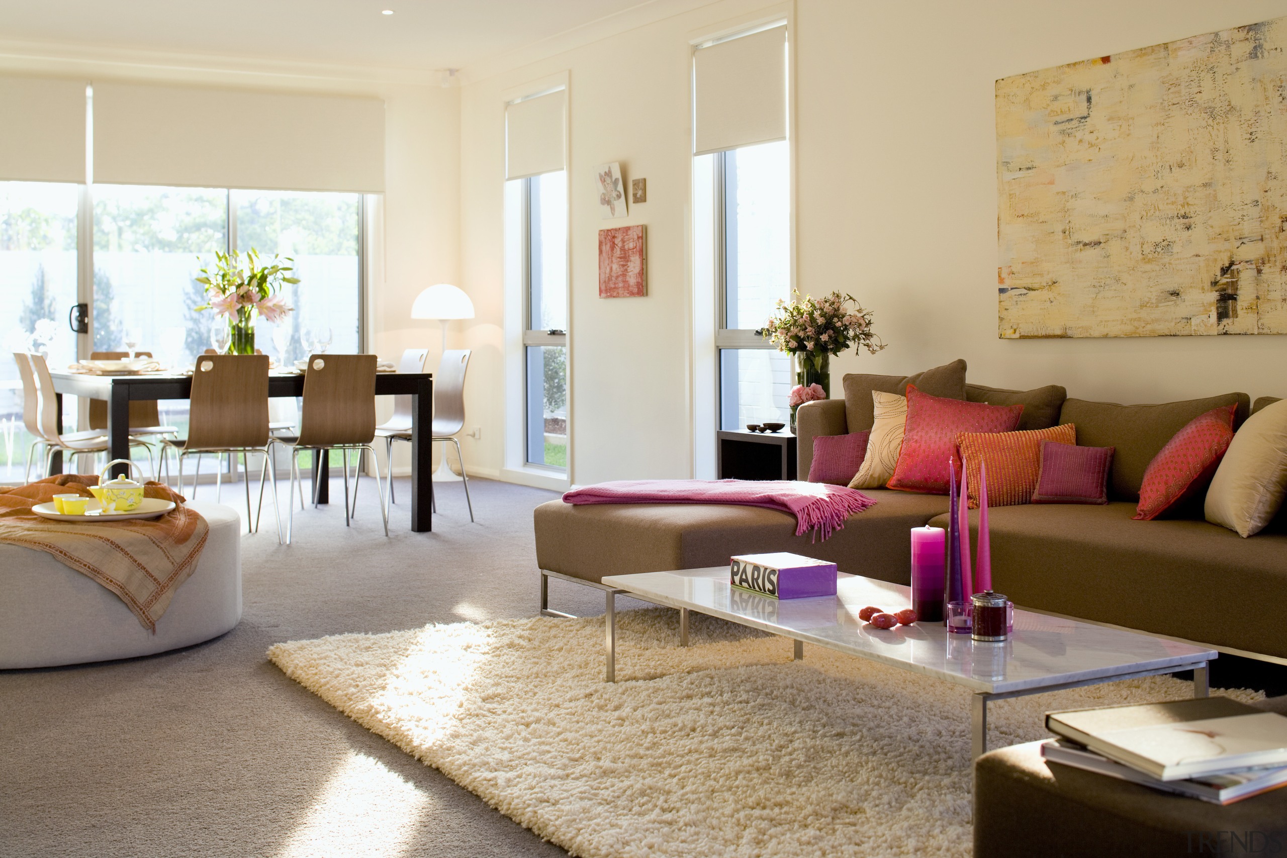 An interior view of the contemporary living areas floor, furniture, home, interior design, living room, real estate, room, table, orange