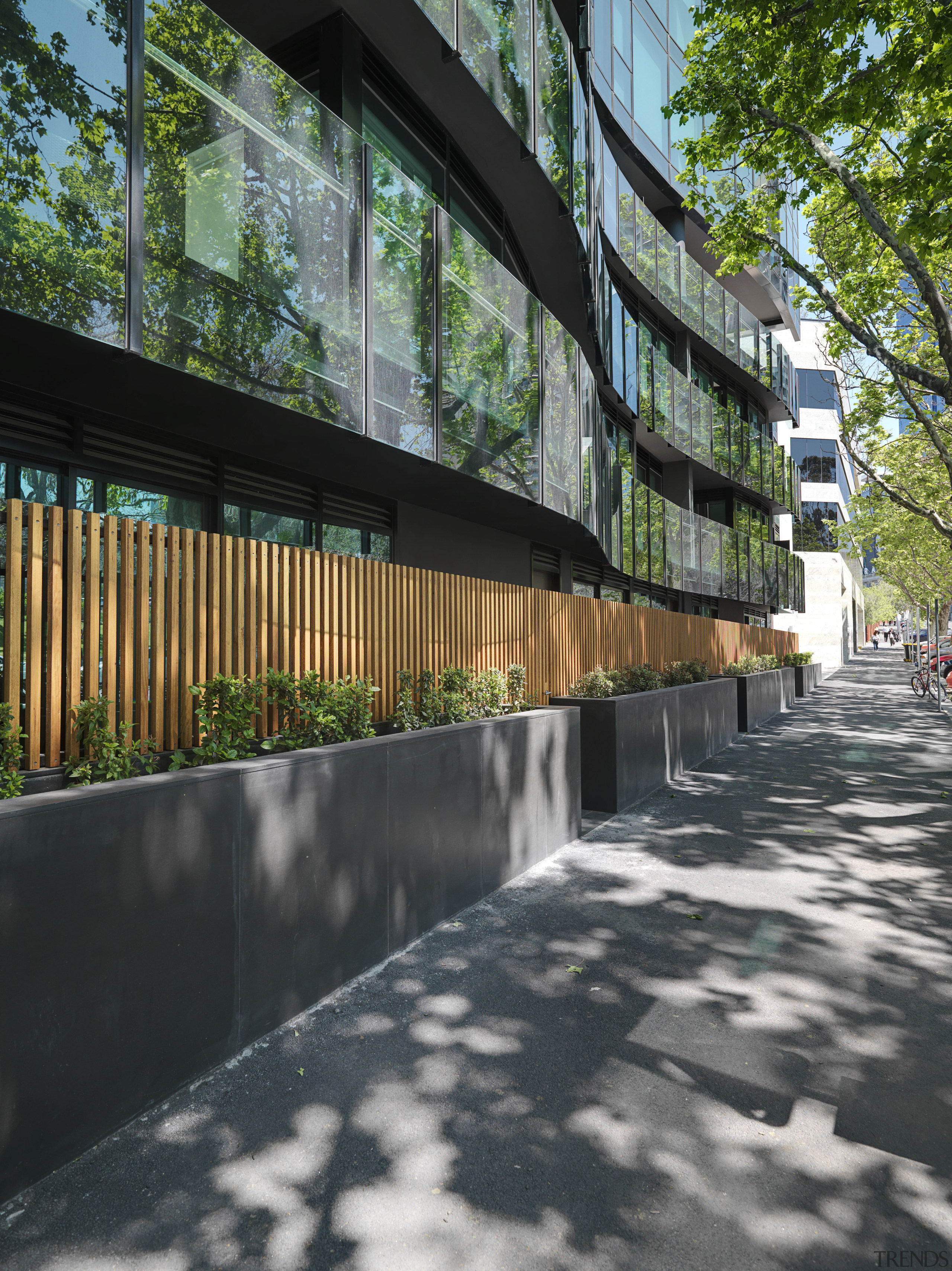 Exterior view of One East Melbourne developed by architecture, building, condominium, facade, house, mixed use, neighbourhood, outdoor structure, real estate, reflection, residential area, tree, urban design, walkway, black