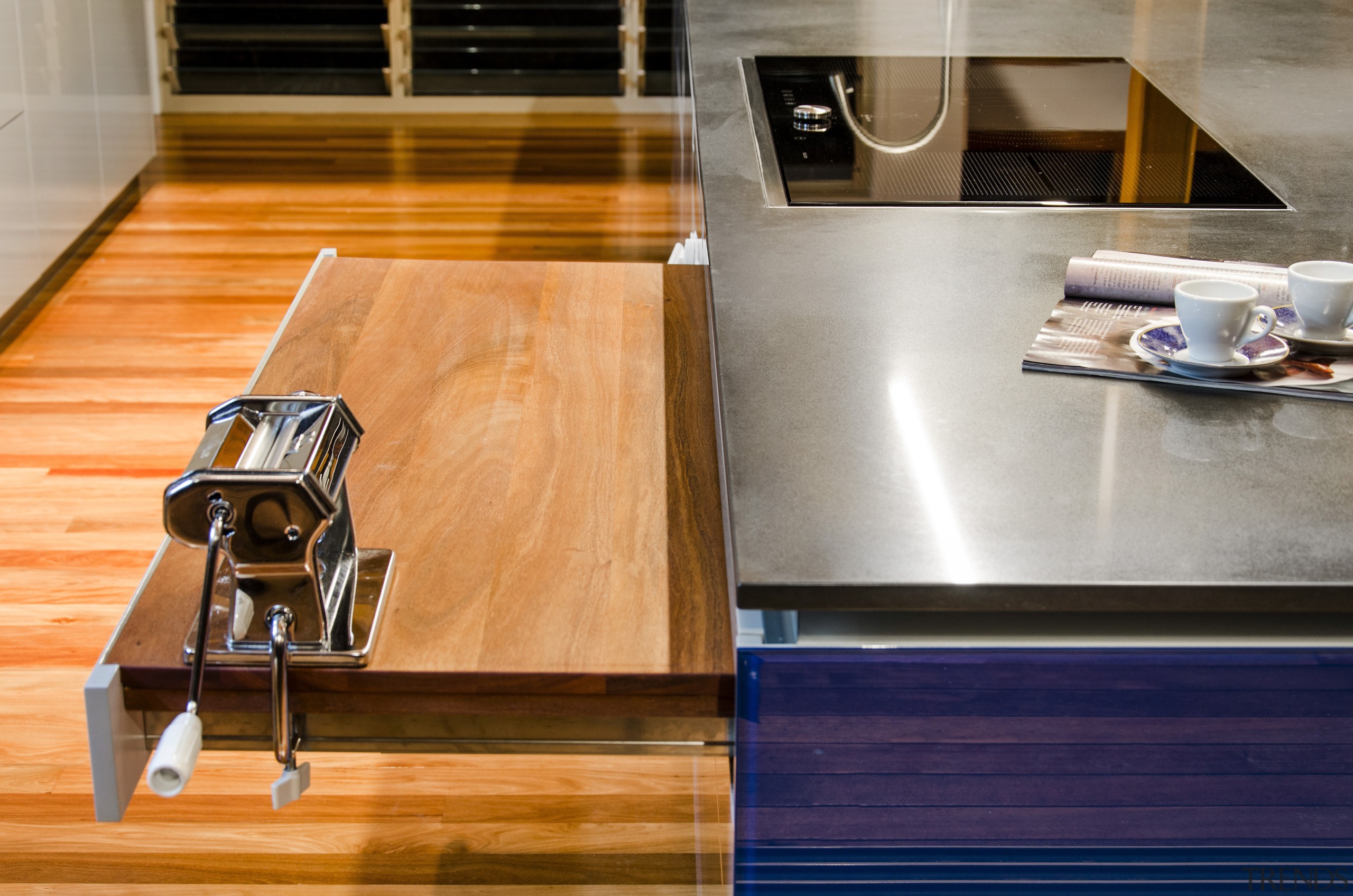 This kitchen was designed by Kim Duffin of countertop, floor, flooring, furniture, hardwood, interior design, kitchen, table, wood, wood flooring, wood stain, orange