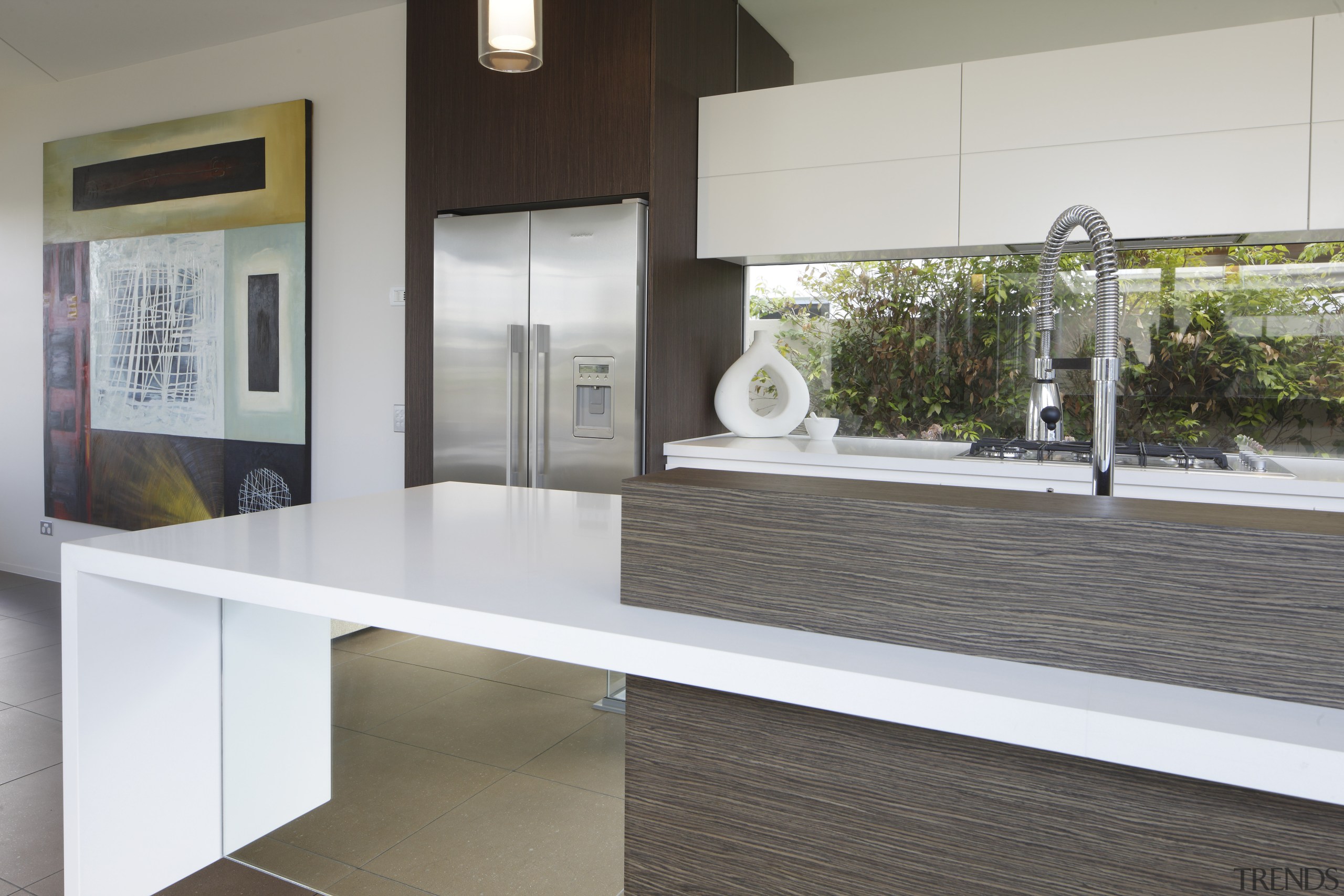 A mirrored finish underneath the kitchen island gives countertop, floor, interior design, real estate, table, gray