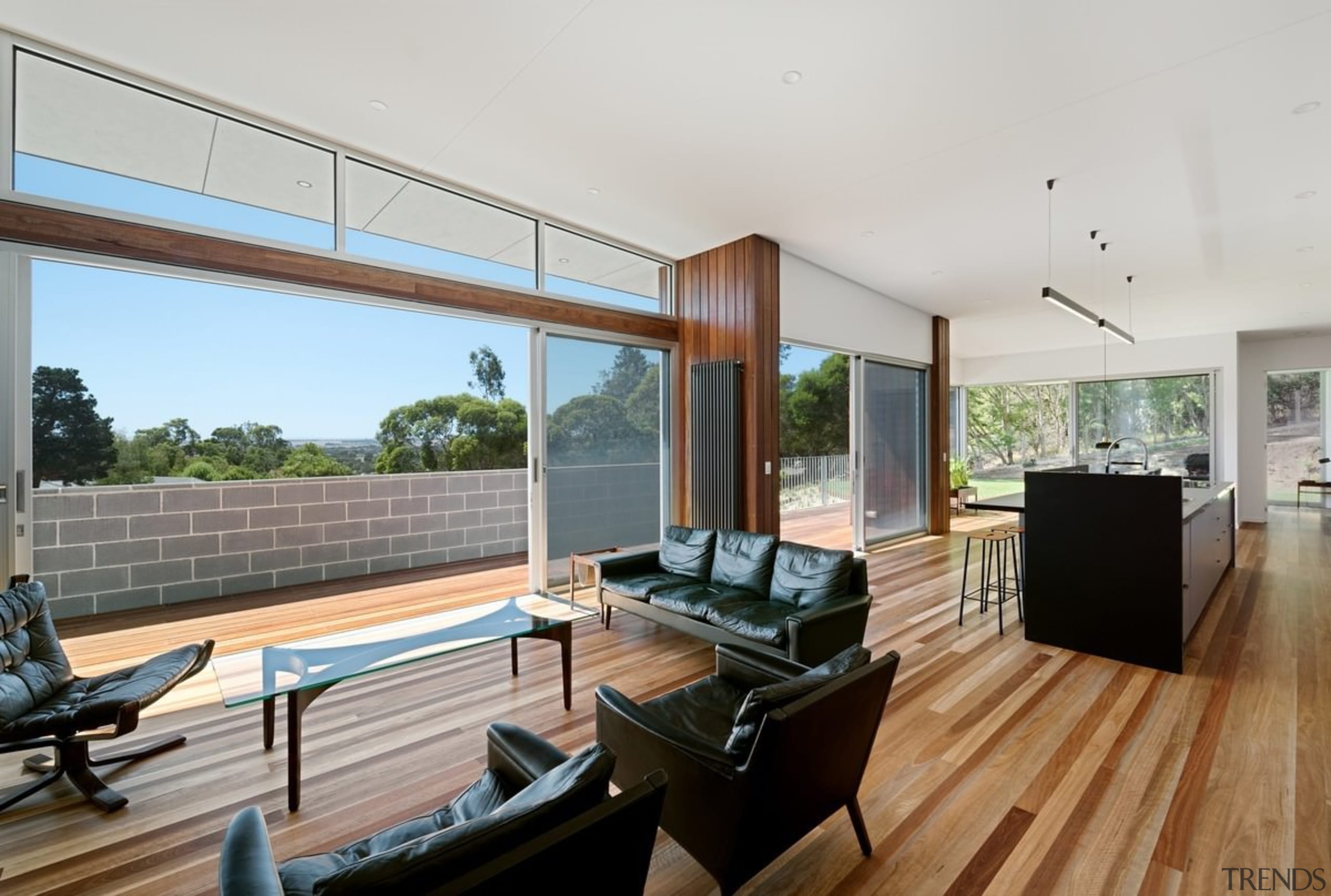 A living area and dining space sandwich the architecture, daylighting, house, interior design, living room, property, real estate, window, gray