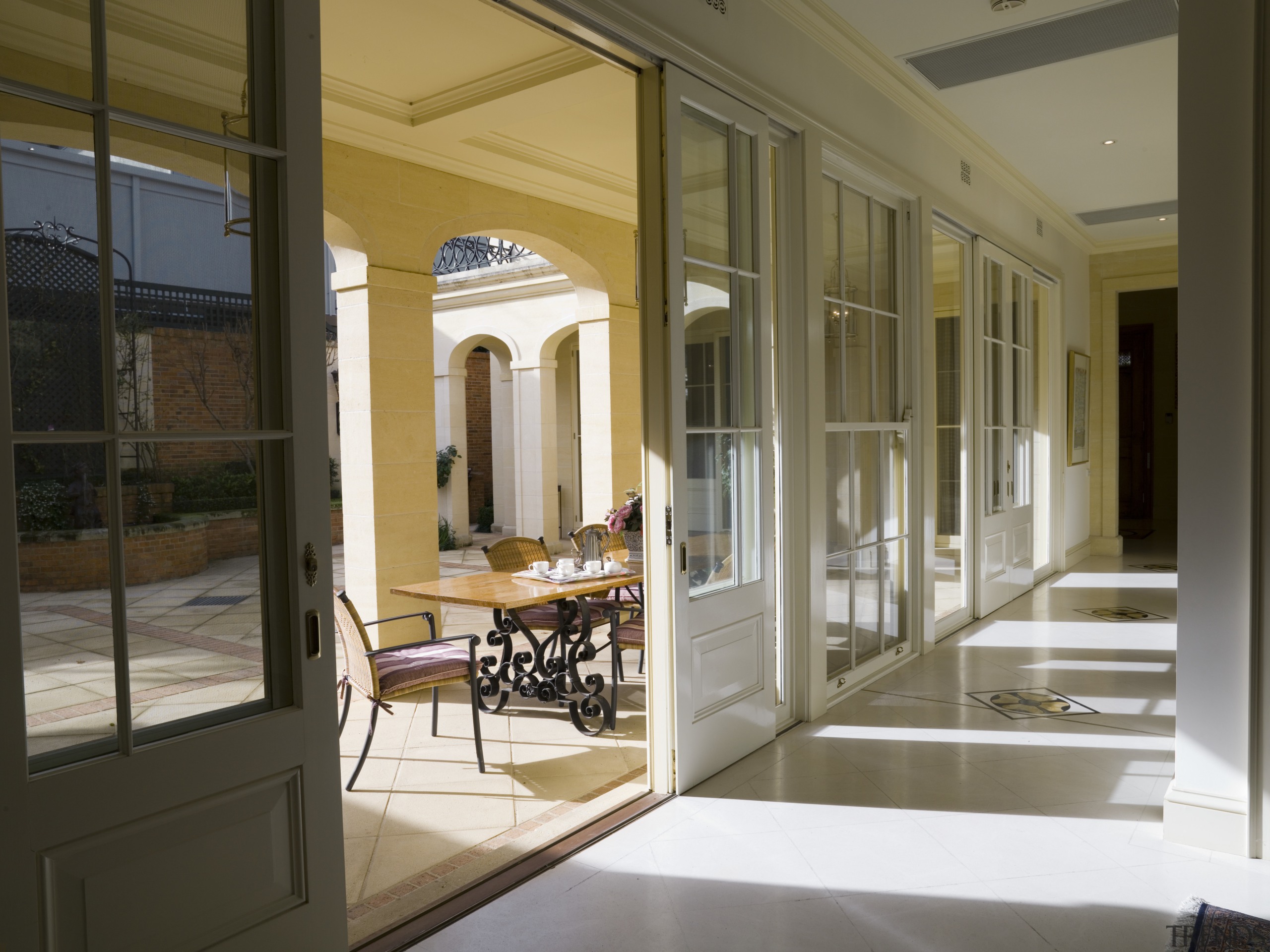 The dining room and kitchen open onto a door, interior design, window, brown