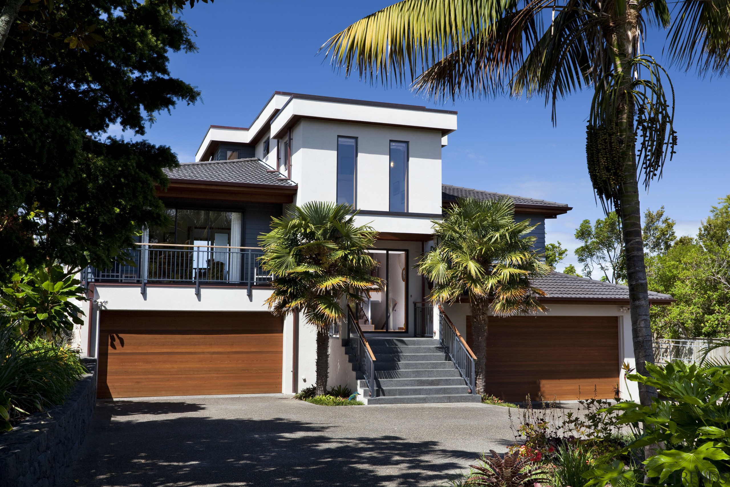 This home was designed and built by Signature architecture, arecales, building, cottage, elevation, estate, facade, home, house, palm tree, property, real estate, residential area, villa, black