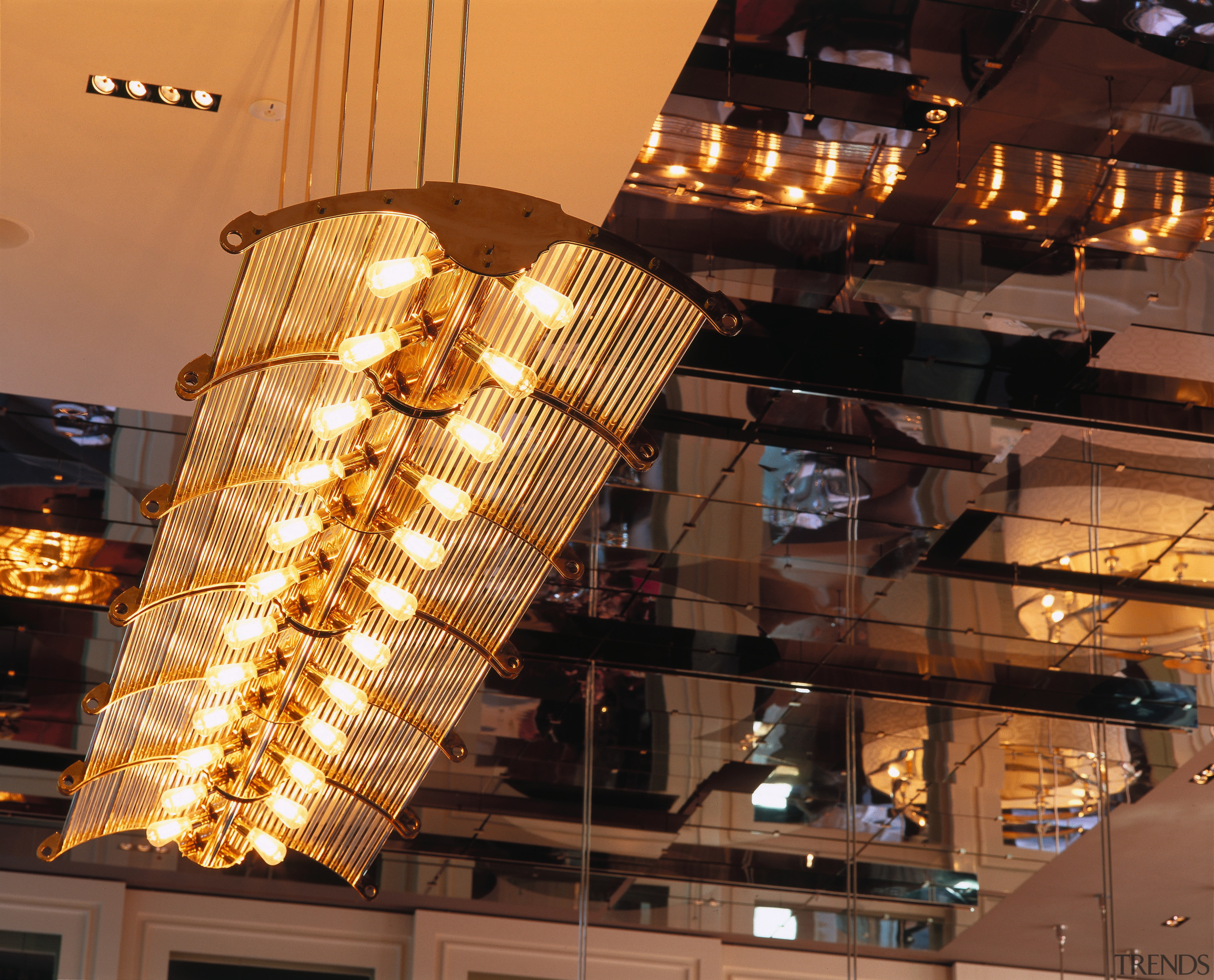 View of large suspended light fitting, and mirrored ceiling, light fixture, lighting, black, brown, orange