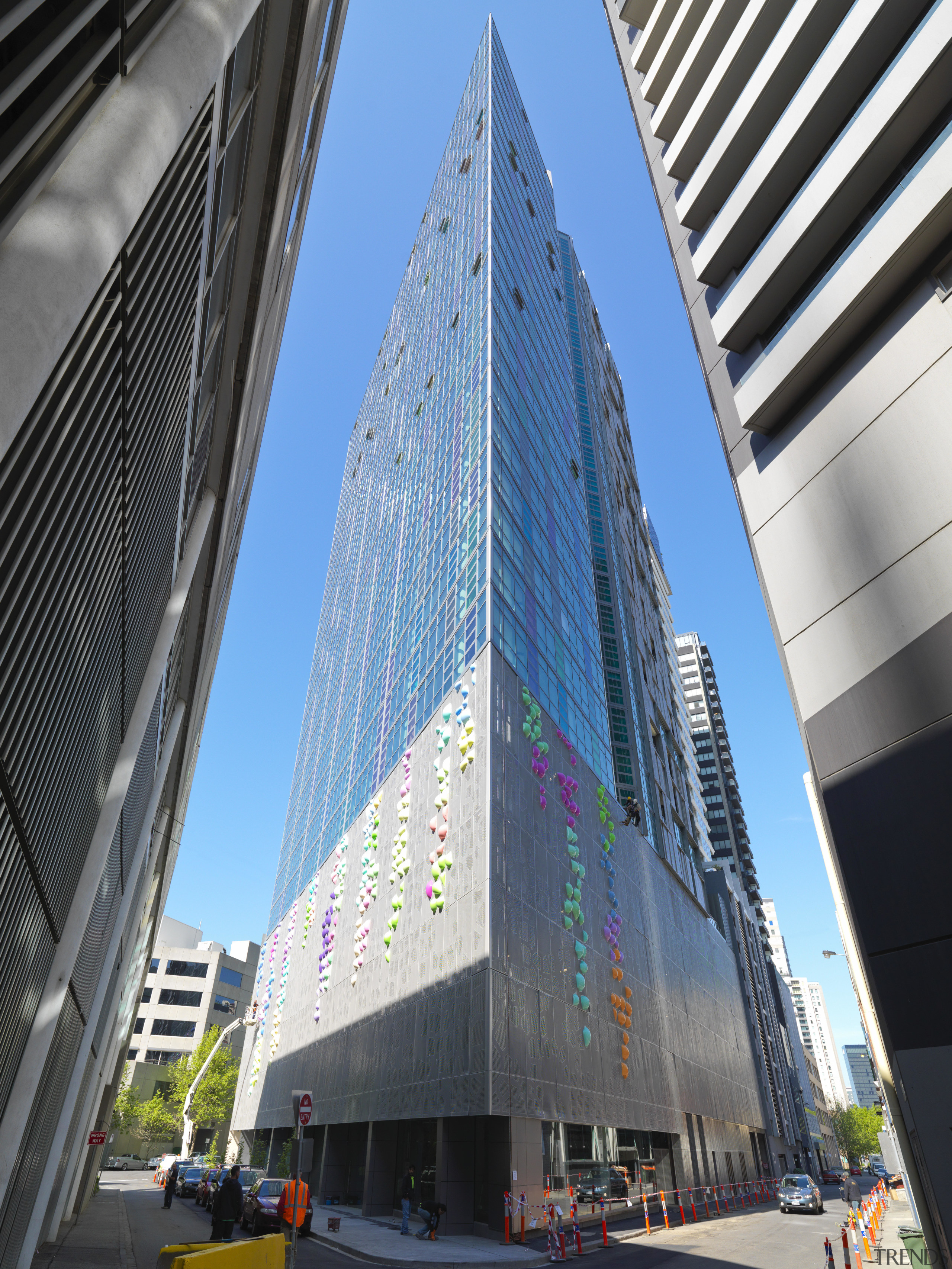 Exterior view of the Triptych residential tower in architecture, building, city, commercial building, condominium, corporate headquarters, daytime, downtown, facade, headquarters, landmark, metropolis, metropolitan area, mixed use, skyscraper, tower, tower block, urban area, black, teal