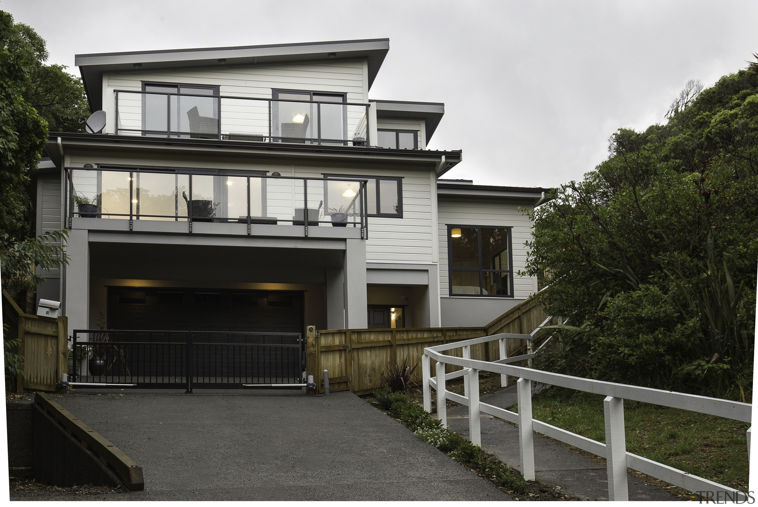 Reflecting on nature  this Lockwood home, built building, cottage, elevation, facade, home, house, property, real estate, residential area, white, black