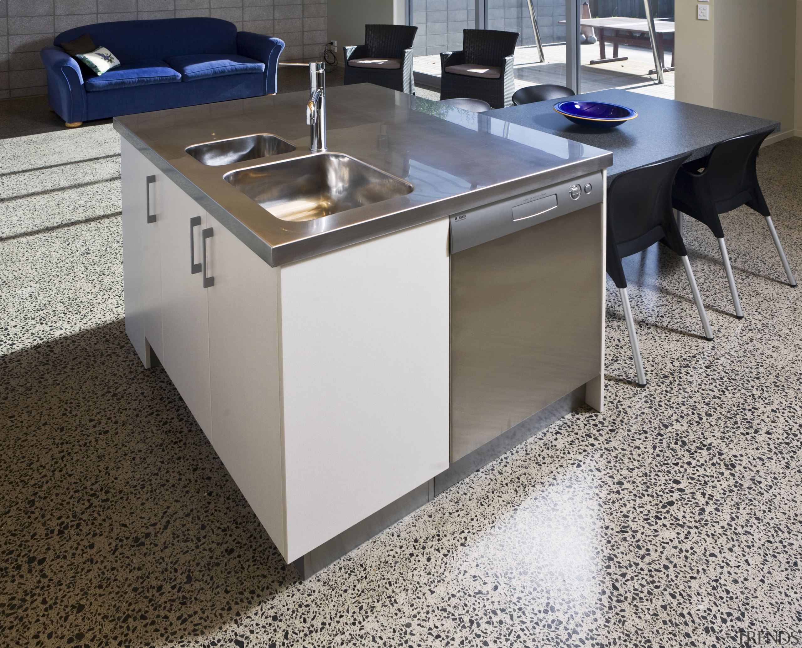 View of kitchen designed by Sheryl Stuart of countertop, desk, floor, flooring, furniture, hardwood, product design, table, gray