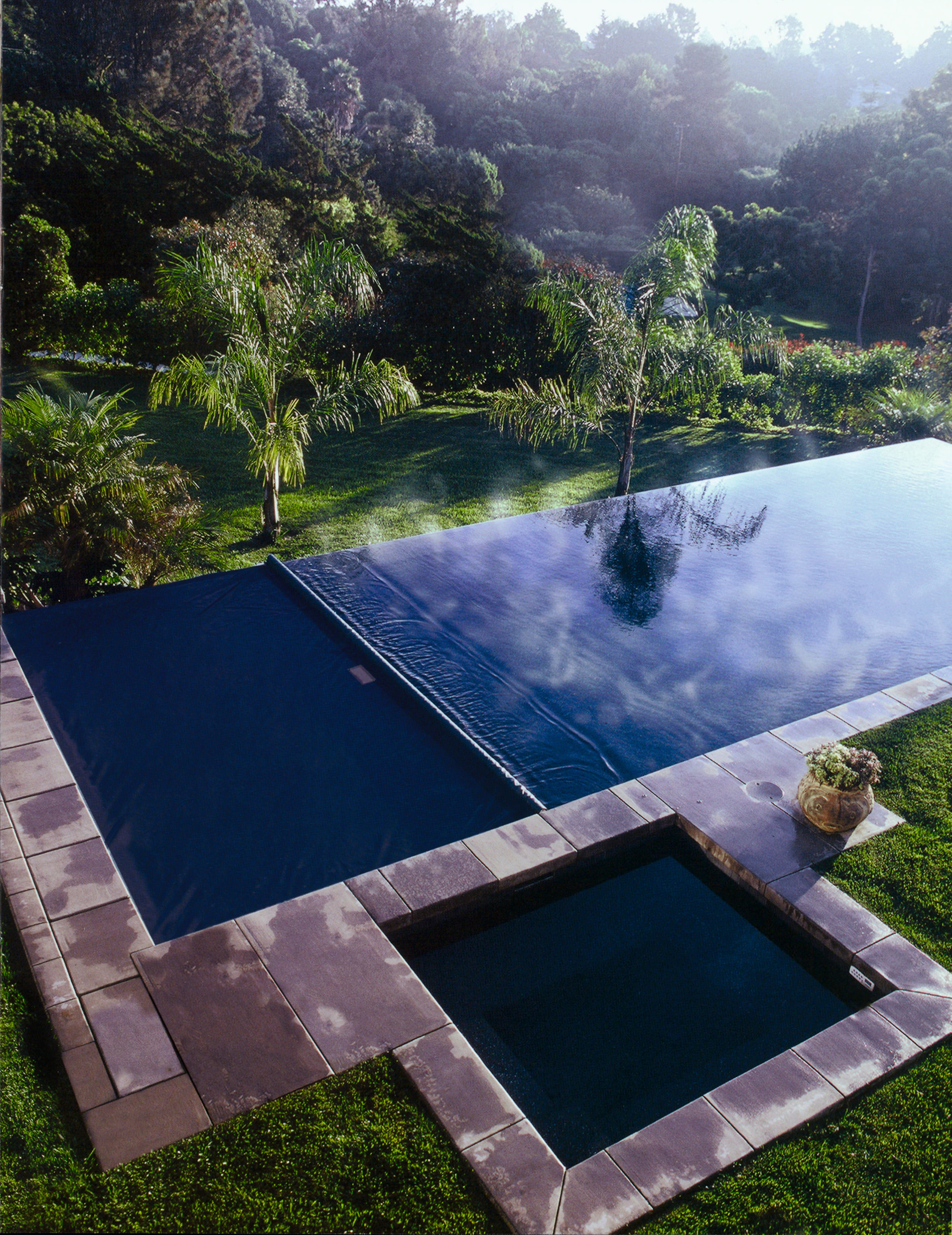 View of swimming pool and automatic pool cover backyard, estate, grass, landscape, leisure, nature, plant, property, real estate, reflection, reservoir, sky, swimming pool, tree, water, water feature, water resources, blue