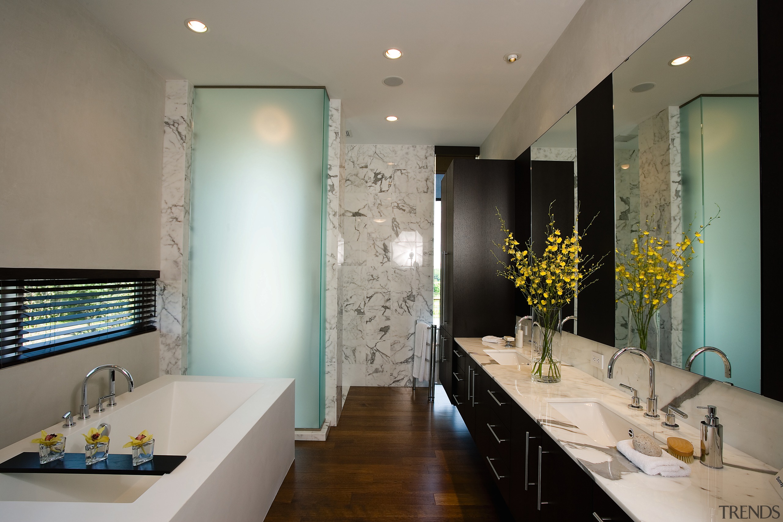 view of this bathroom featuring timber flooring, bathrub, architecture, bathroom, ceiling, countertop, home, interior design, real estate, room, gray