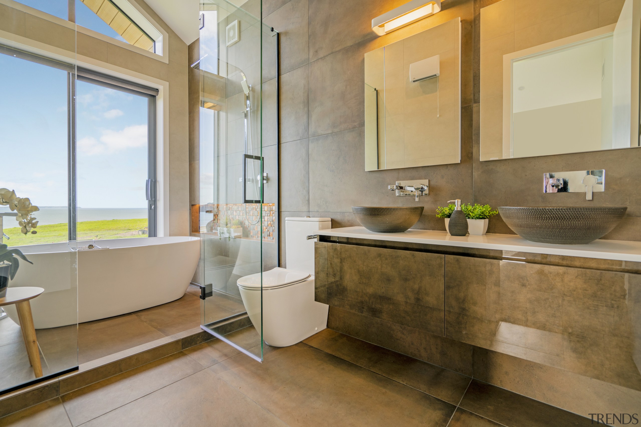 Putting the bath in the shower enclosure enables 