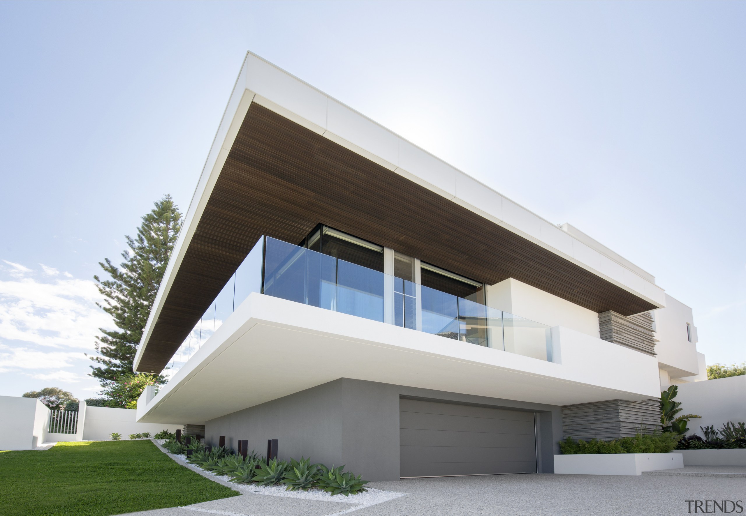 The living floor of this seaside house by architecture, building, commercial building, corporate headquarters, elevation, facade, home, house, official residence, property, real estate, residential area, villa, white