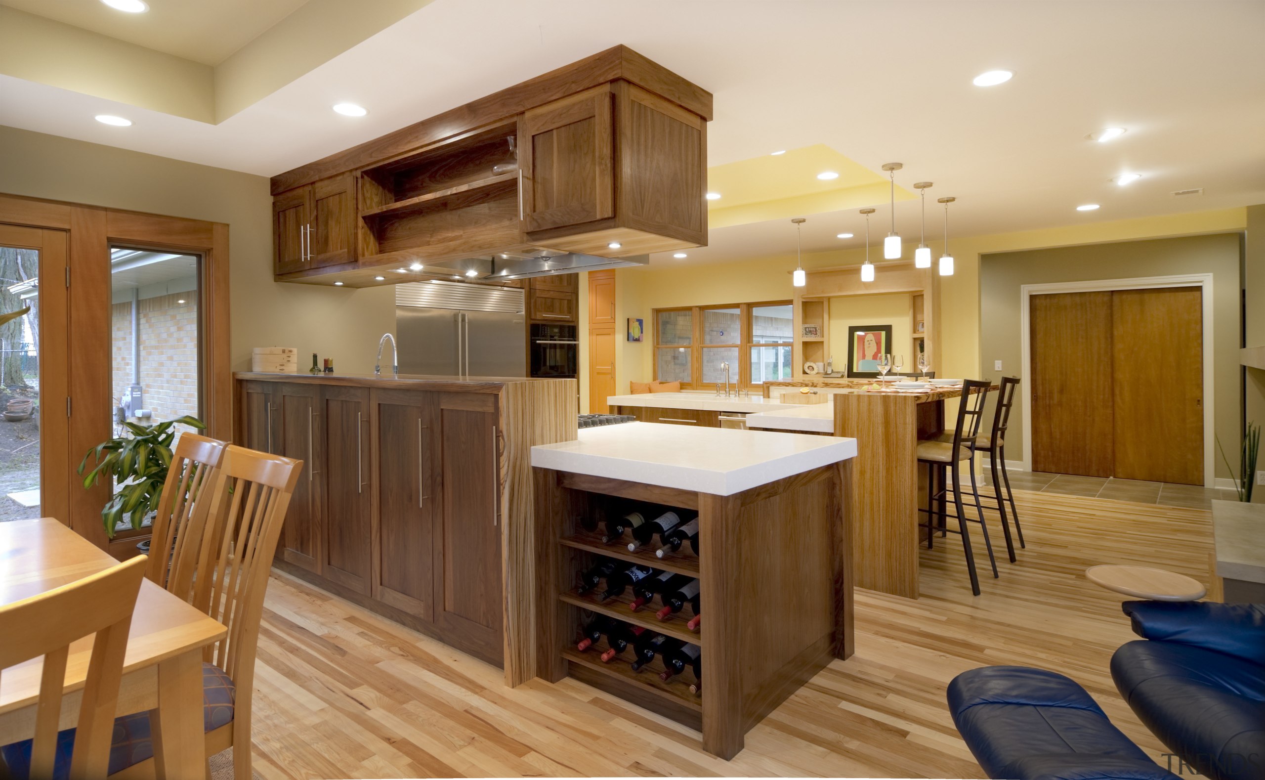 View of a kitchen which features a L-shaped cabinetry, ceiling, countertop, cuisine classique, floor, flooring, hardwood, interior design, kitchen, laminate flooring, real estate, room, wood, wood flooring, brown, orange