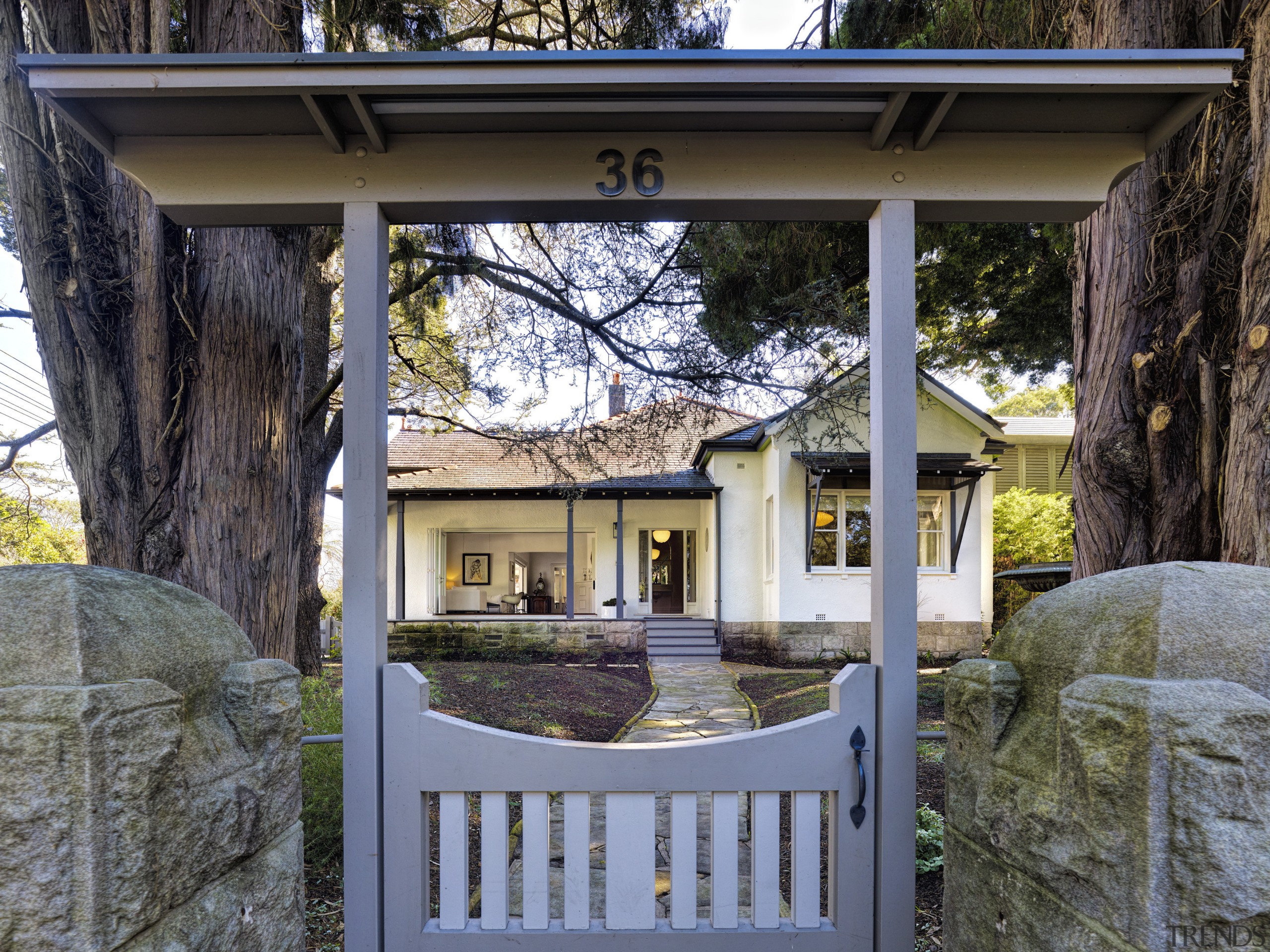 For this renovation project by Willett Architects, the cottage, home, house, plant, real estate, tree, black, gray