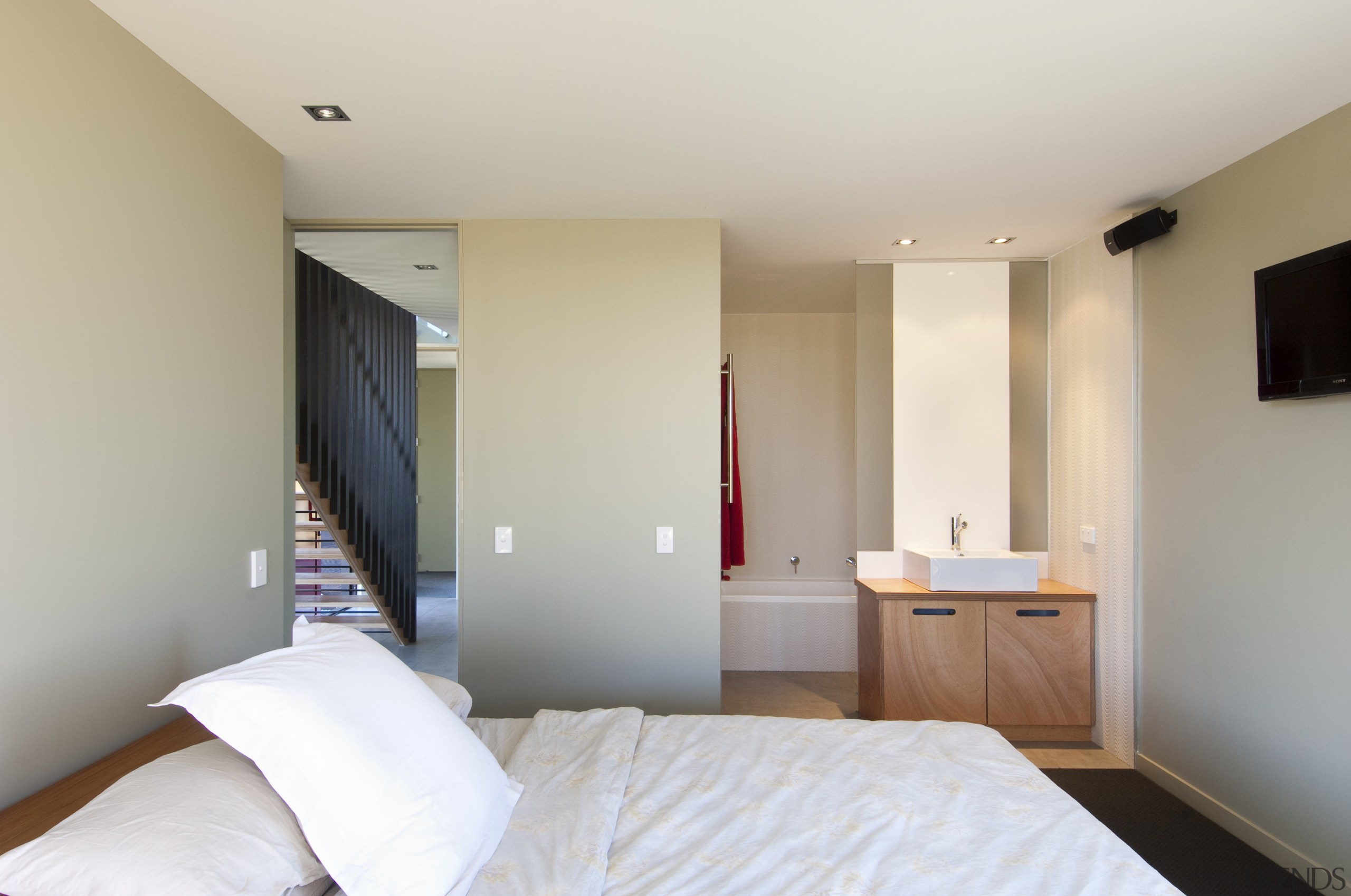 View of bedroom with neutral colour scheme. - bed, bedroom, ceiling, floor, furniture, hotel, interior design, property, real estate, room, suite, gray
