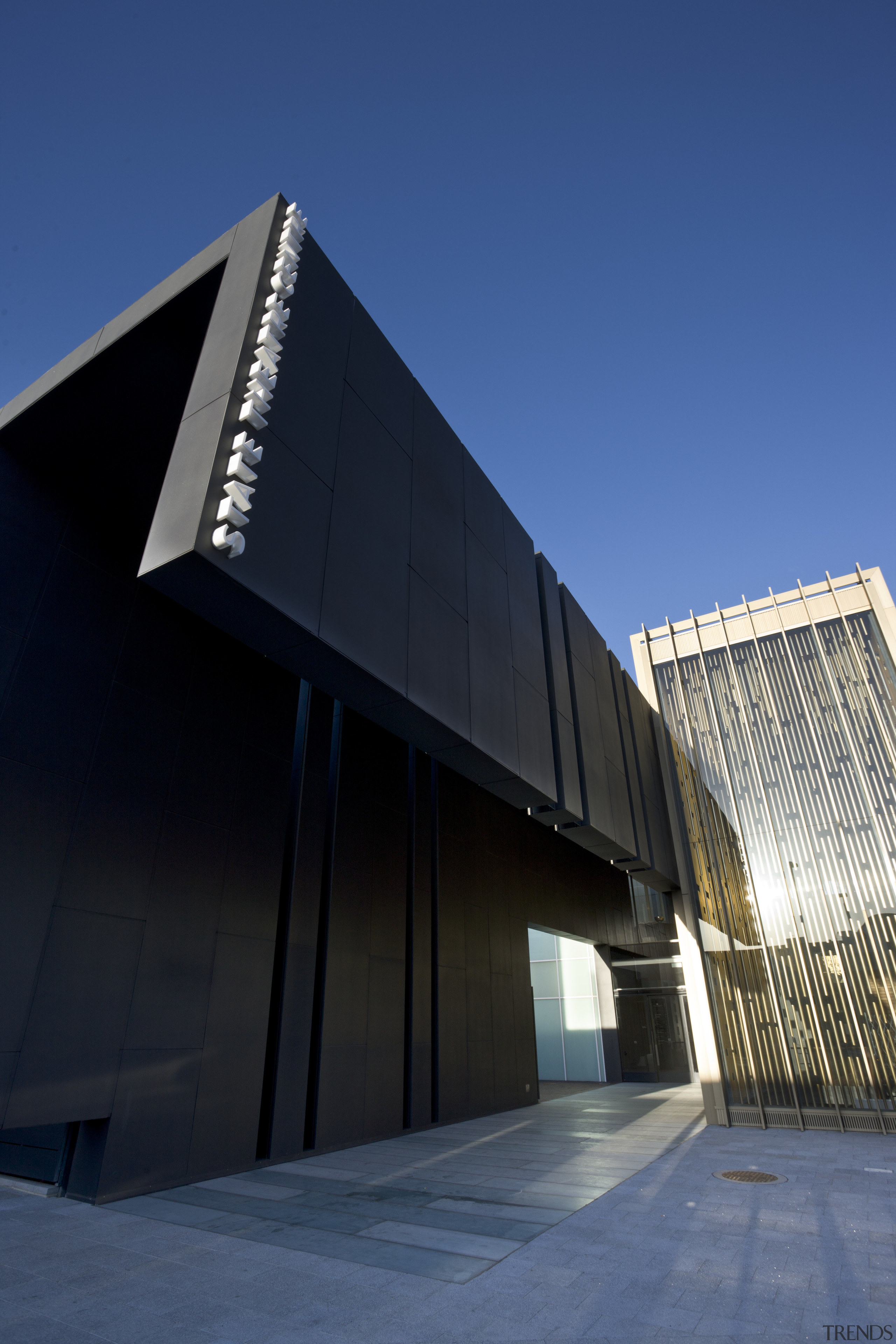 This is the Perth State Theatre, designed by architecture, brutalist architecture, building, commercial building, corporate headquarters, daylighting, daytime, facade, fixed link, headquarters, landmark, metropolitan area, sky, structure, blue, black