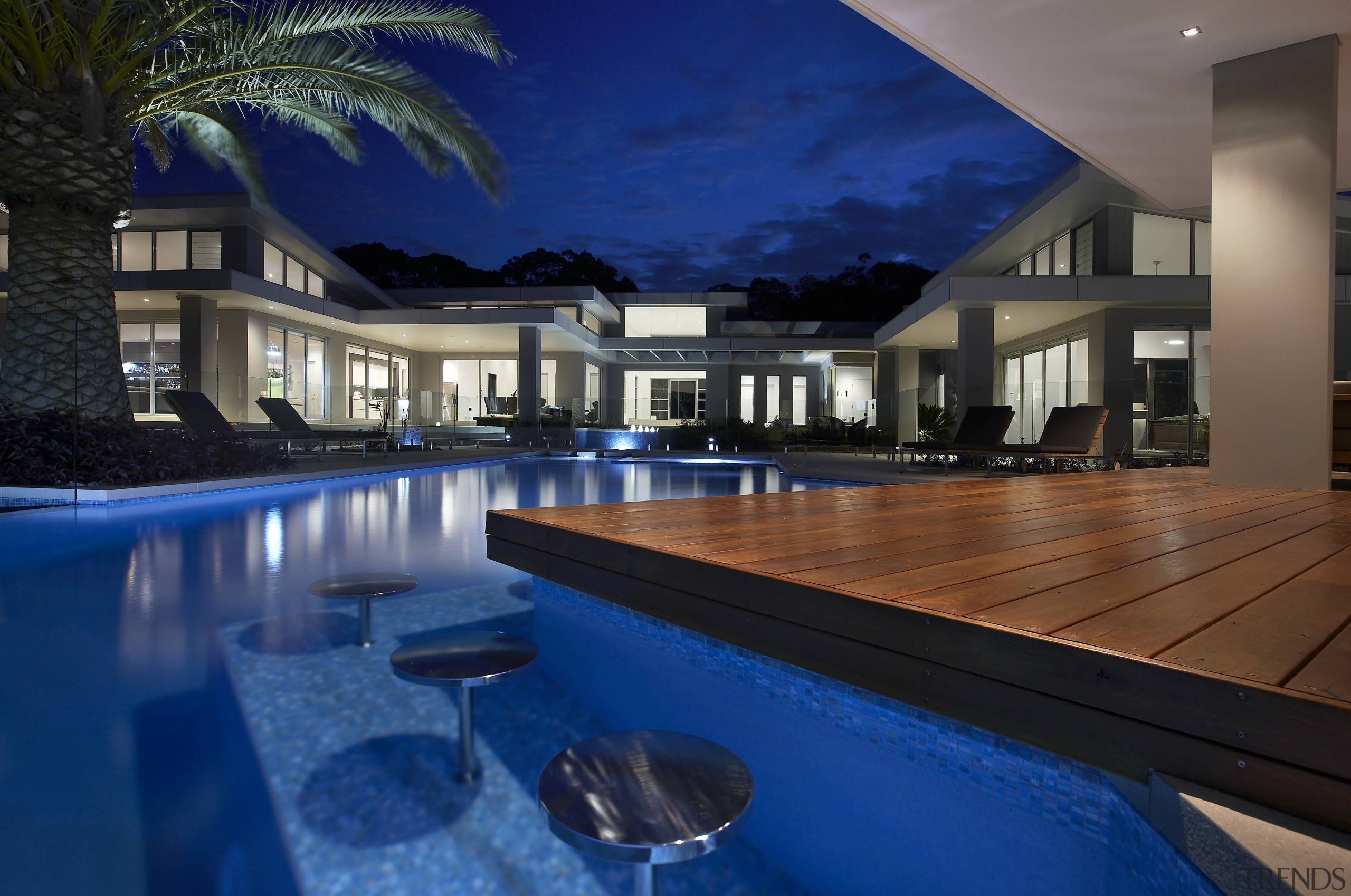 This home's landscape was designed by Dean Herald apartment, architecture, estate, home, house, interior design, leisure, lighting, property, real estate, reflection, resort, resort town, swimming pool, villa, water, blue, black