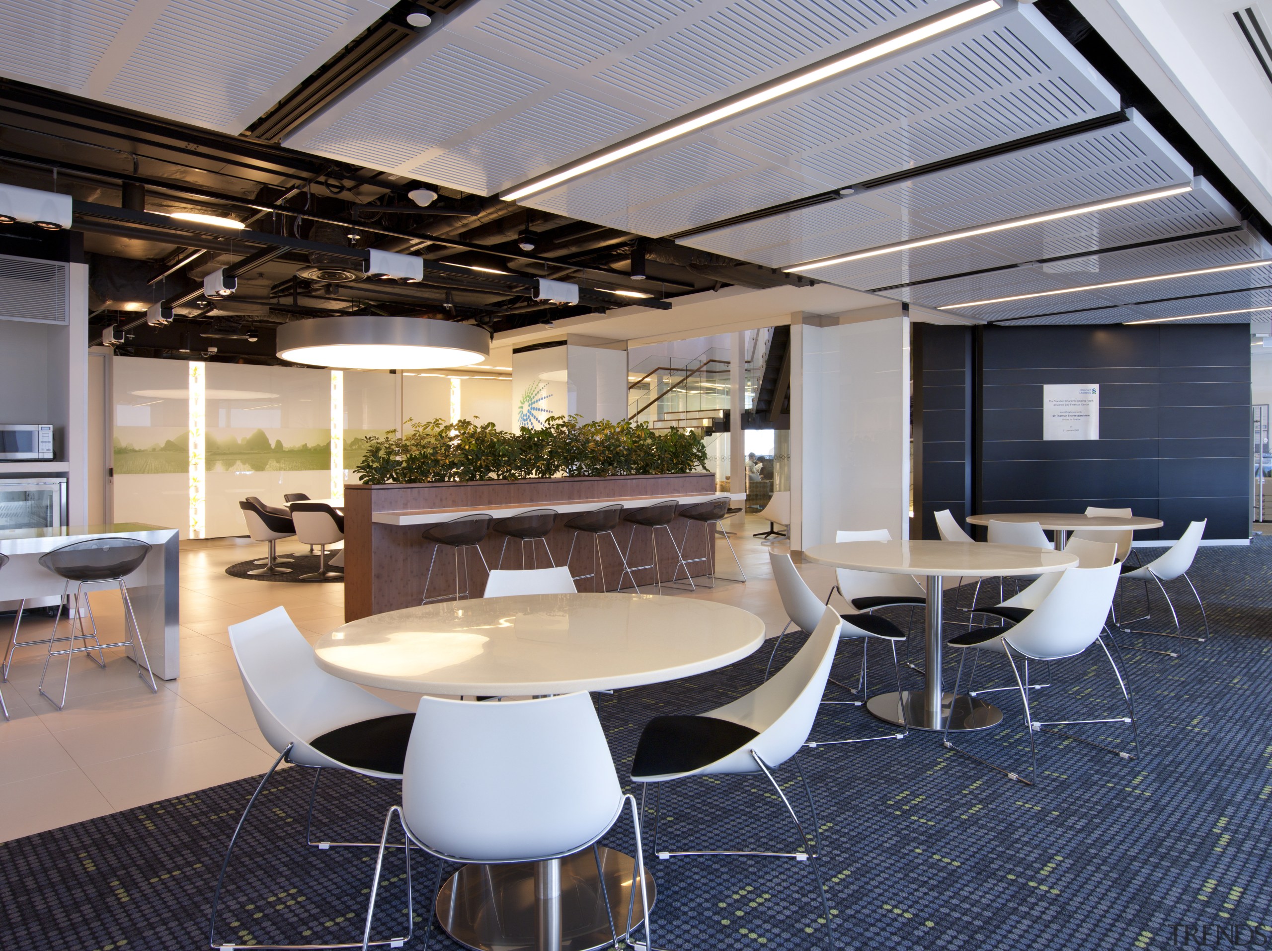 View of a contemporary corporate space with decorative furniture, interior design, office, real estate, roof, table, gray