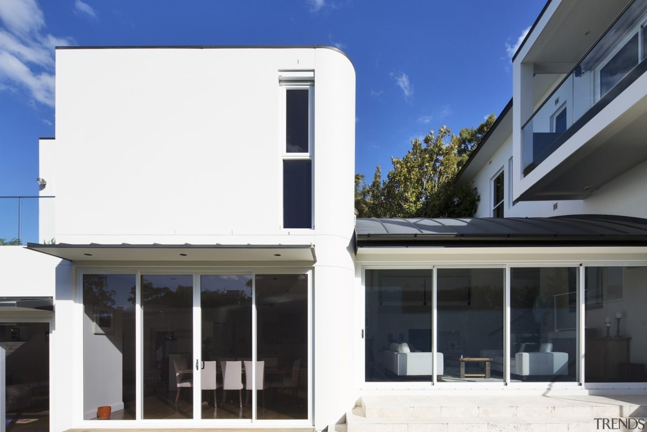 The home is centred around the location, facing architecture, building, elevation, facade, home, house, property, real estate, roof, window, white, black