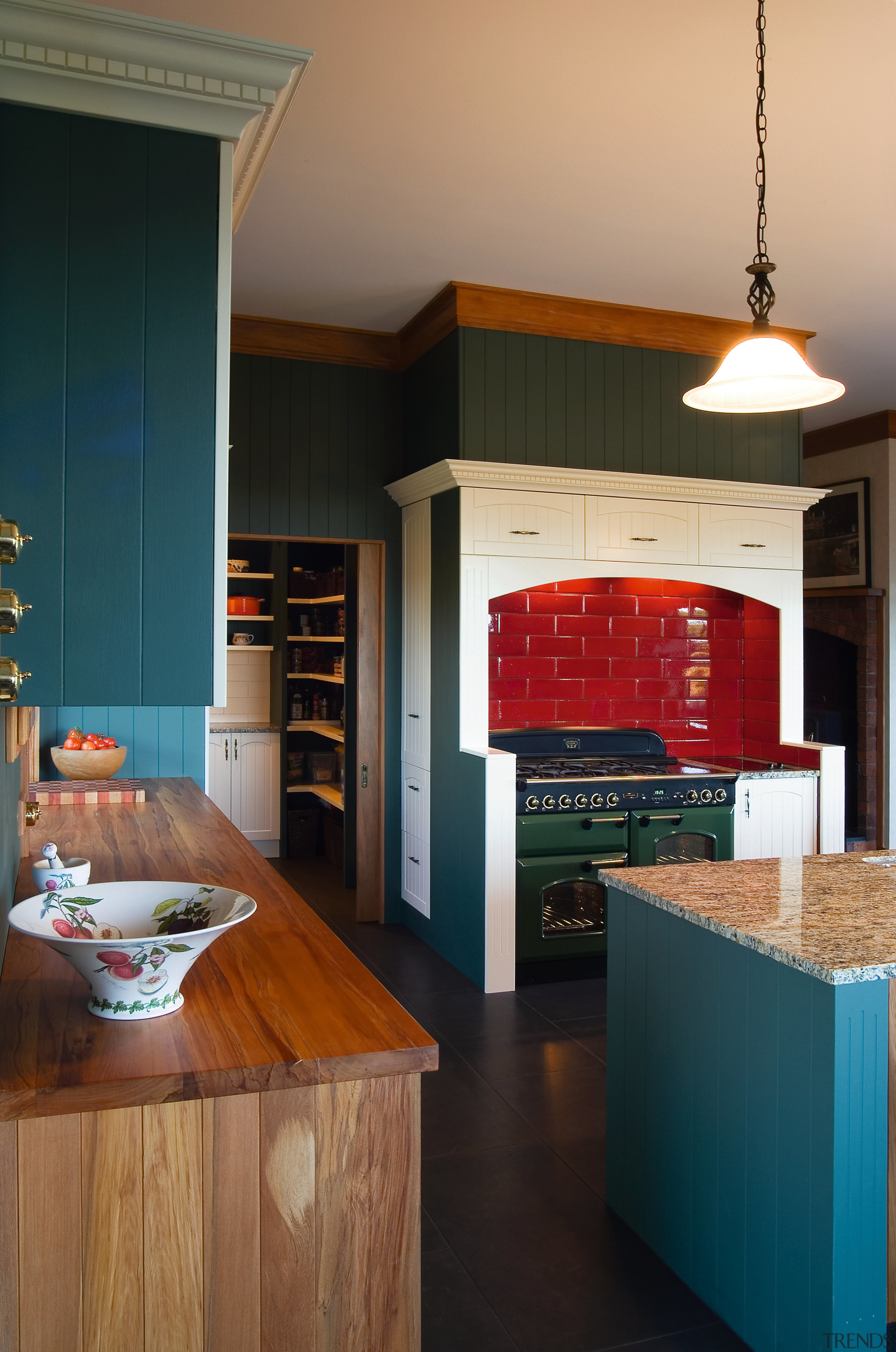 A view of some kitchen cabinetry by The cabinetry, countertop, furniture, hardwood, home, interior design, kitchen, living room, room, table, wood, black