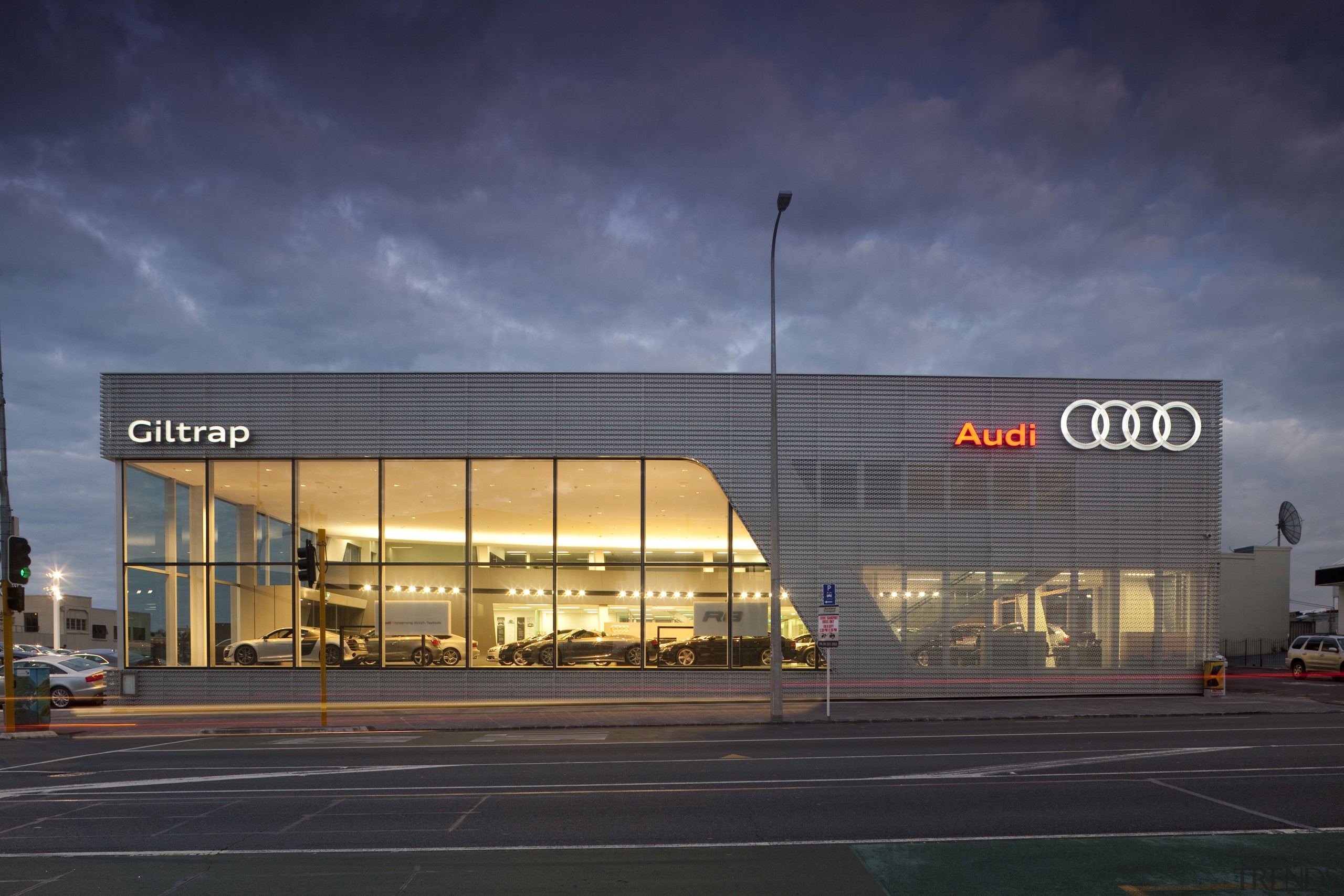 Here is an exterior view of the new architecture, building, car, car dealership, corporate headquarters, evening, night, sky, blue, black