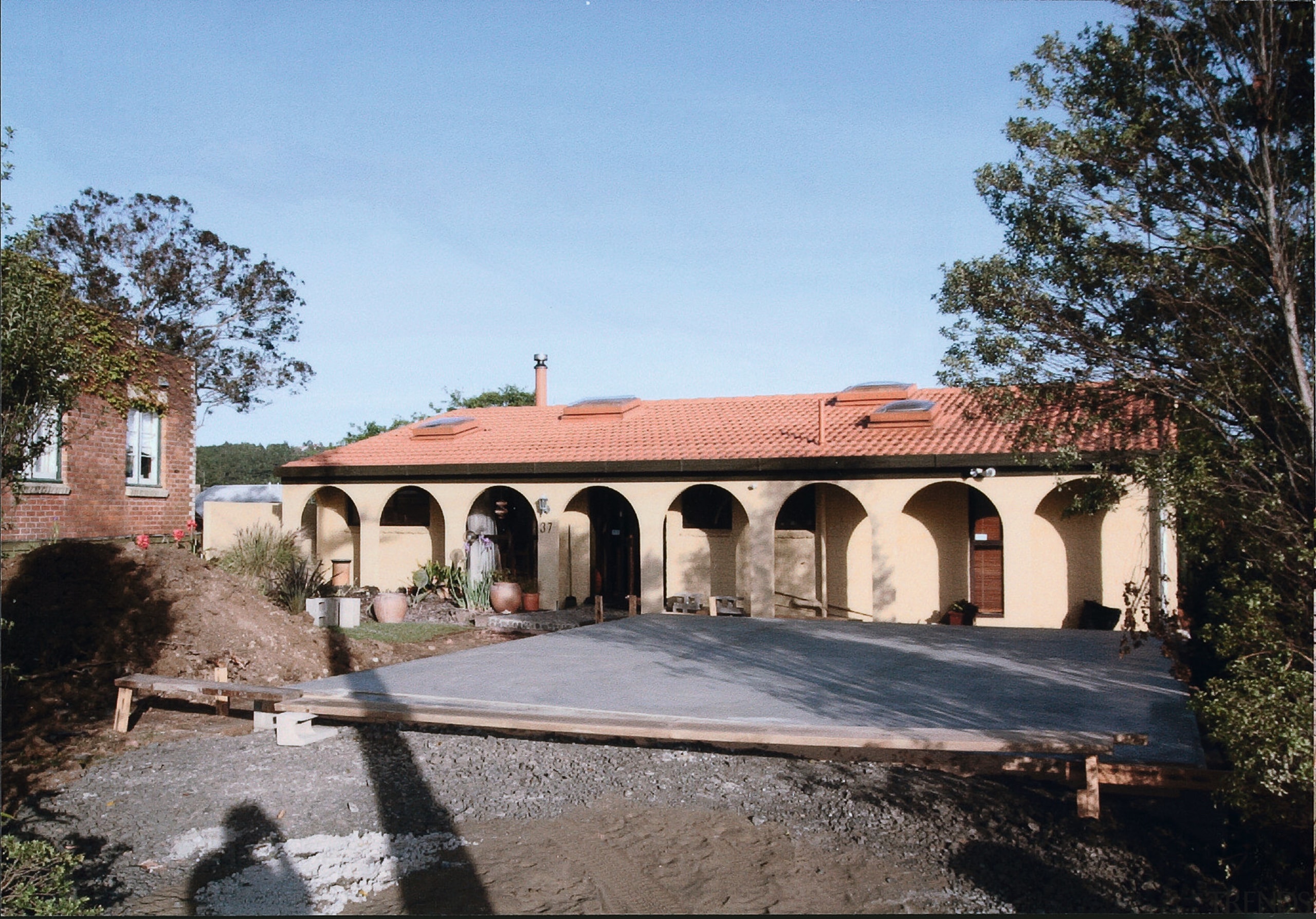 Origional Hacienda-style house prior to the renovations using building, estate, facade, hacienda, historic site, house, property, real estate, villa, teal, black