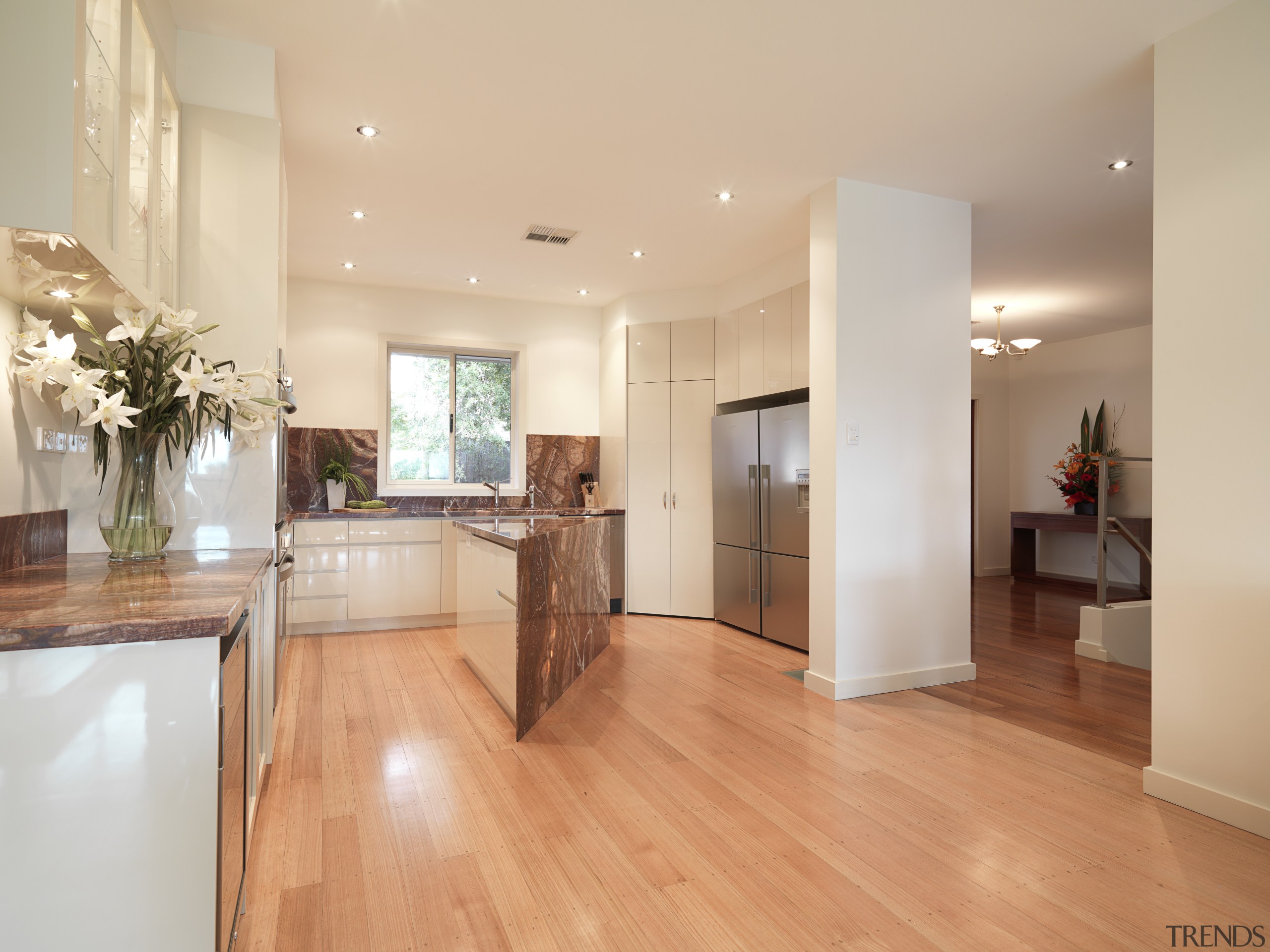 View of contemporary kitchen with light wooden flooring, floor, flooring, hardwood, home, interior design, kitchen, laminate flooring, living room, property, real estate, room, wood, wood flooring, orange