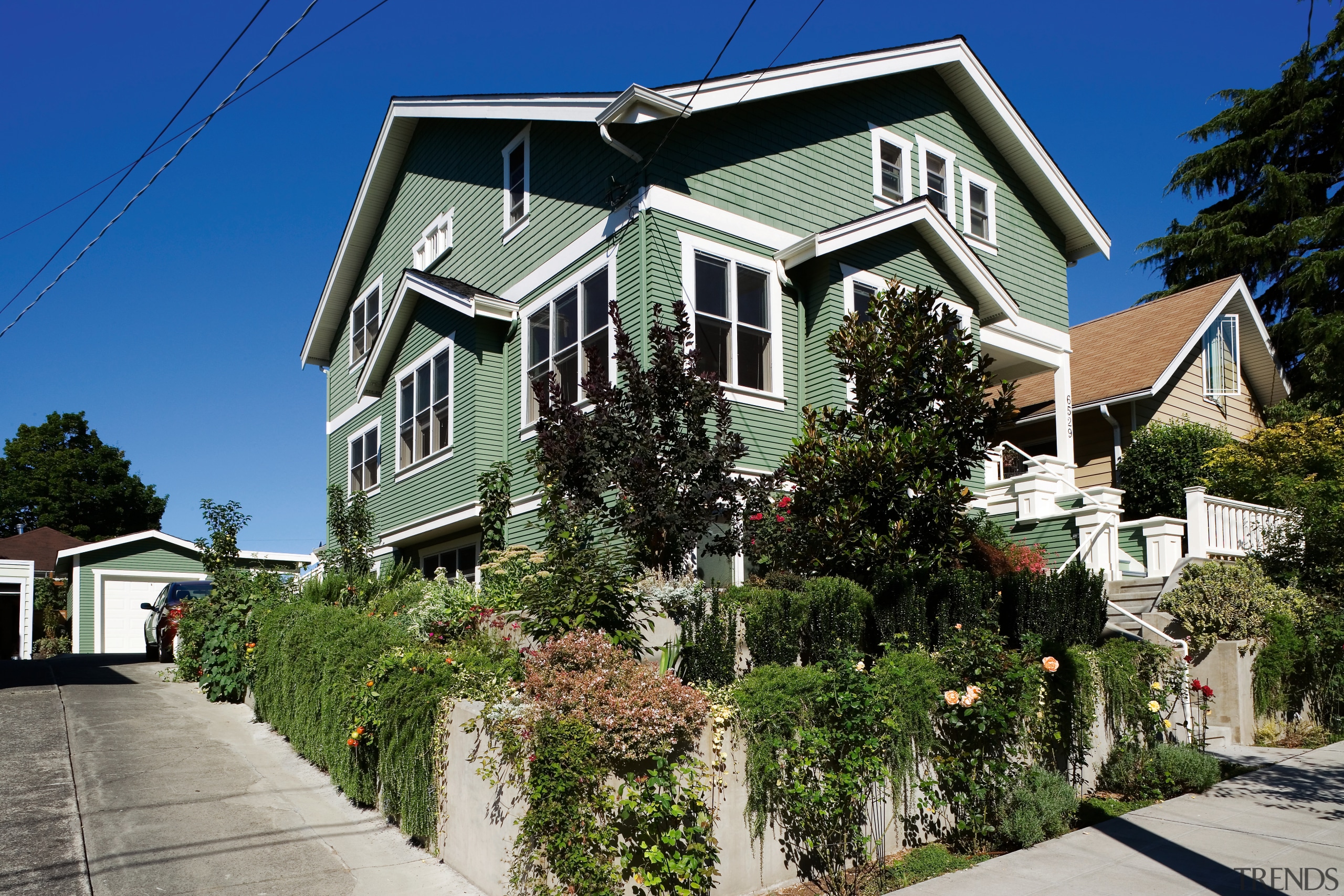 An exterior view of the home. - An architecture, building, cottage, estate, facade, home, house, neighbourhood, plant, property, real estate, residential area, roof, siding, sky, suburb, tree, window