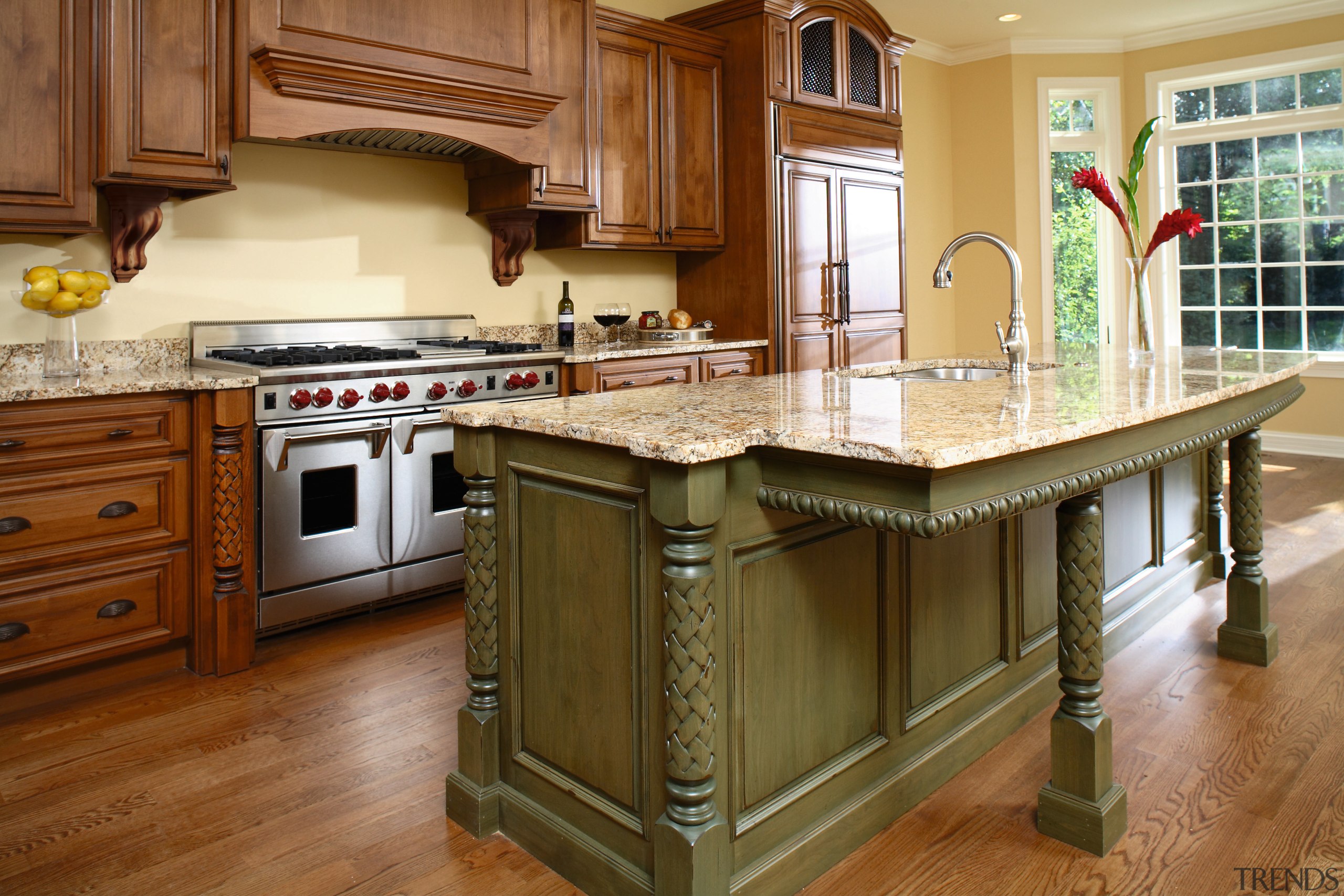 View of these intricate turned wood columns in cabinetry, countertop, cuisine classique, floor, flooring, furniture, hardwood, interior design, kitchen, laminate flooring, room, wood, wood flooring, wood stain, brown