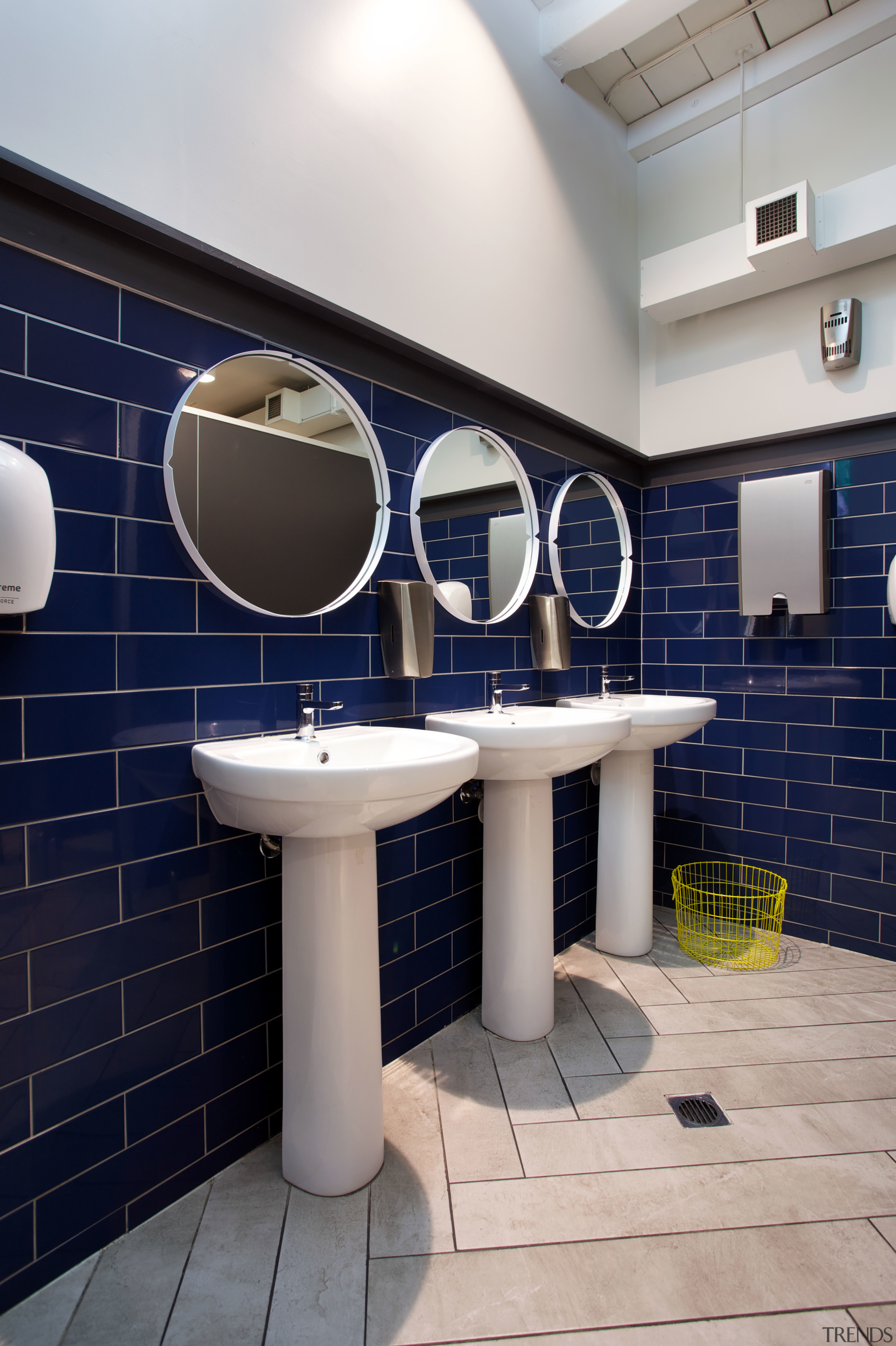 The blue and yellow decor of The Crew architecture, bathroom, floor, interior design, public toilet, room, tile, wall, gray, blue