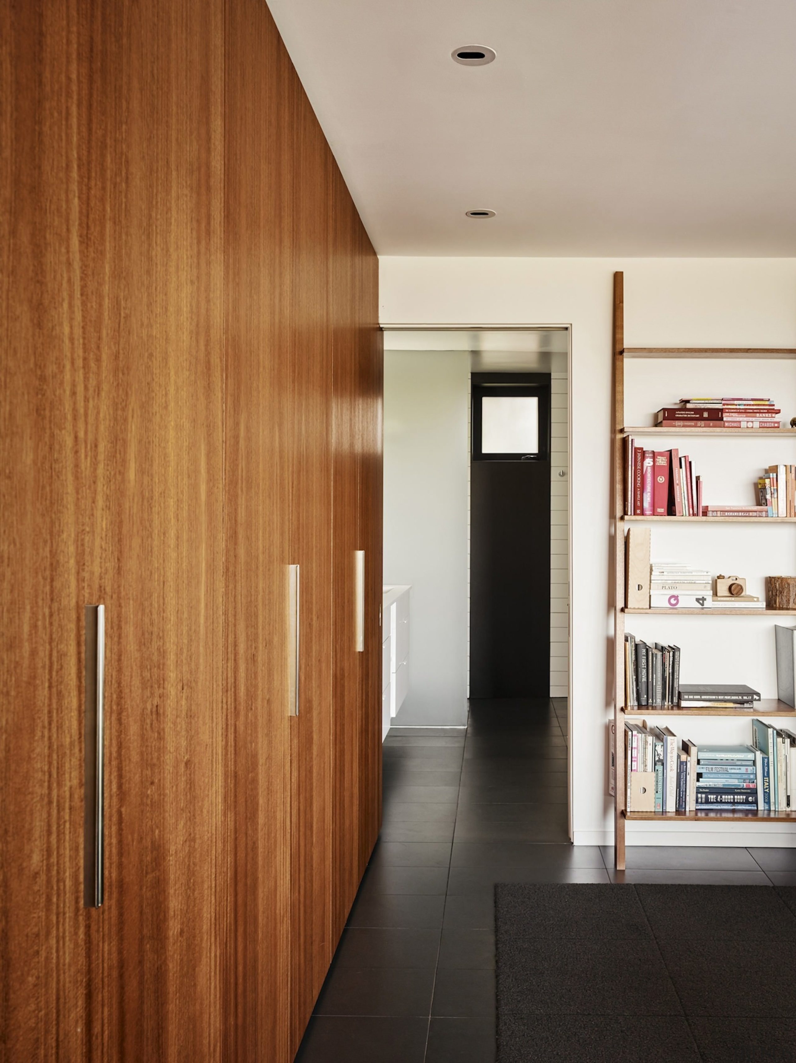 There's ample storage space throughout - There's ample architecture, ceiling, door, floor, flooring, house, interior design, wall, wood, brown, gray