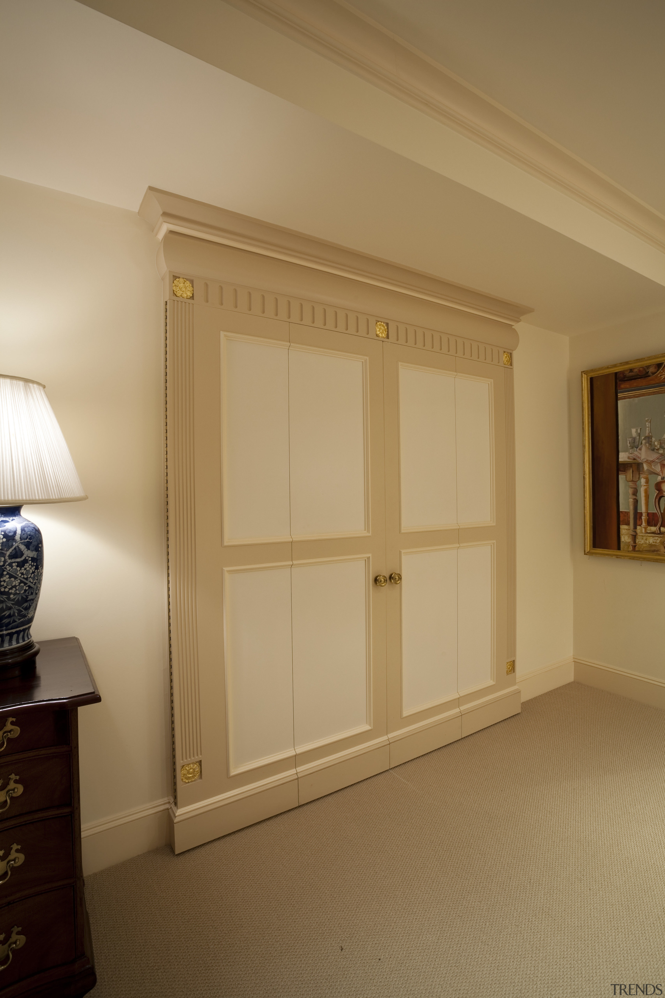 View of desk area under a staircase. - cabinetry, ceiling, door, floor, furniture, home, interior design, molding, room, wall, window, wood, wood stain, orange, brown