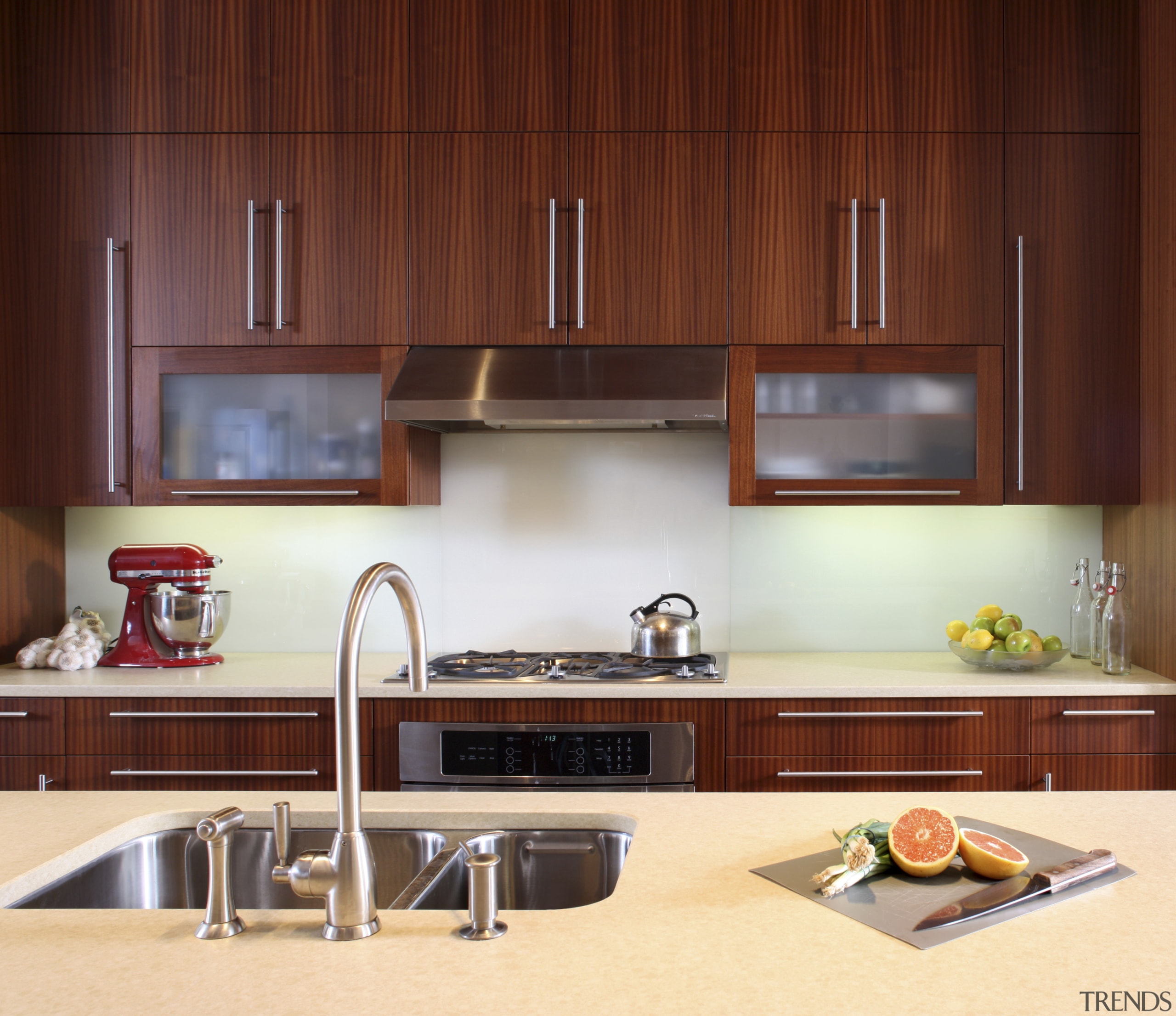 View of a kitchen which features limestone countertops, cabinetry, countertop, cuisine classique, interior design, kitchen, under cabinet lighting, red