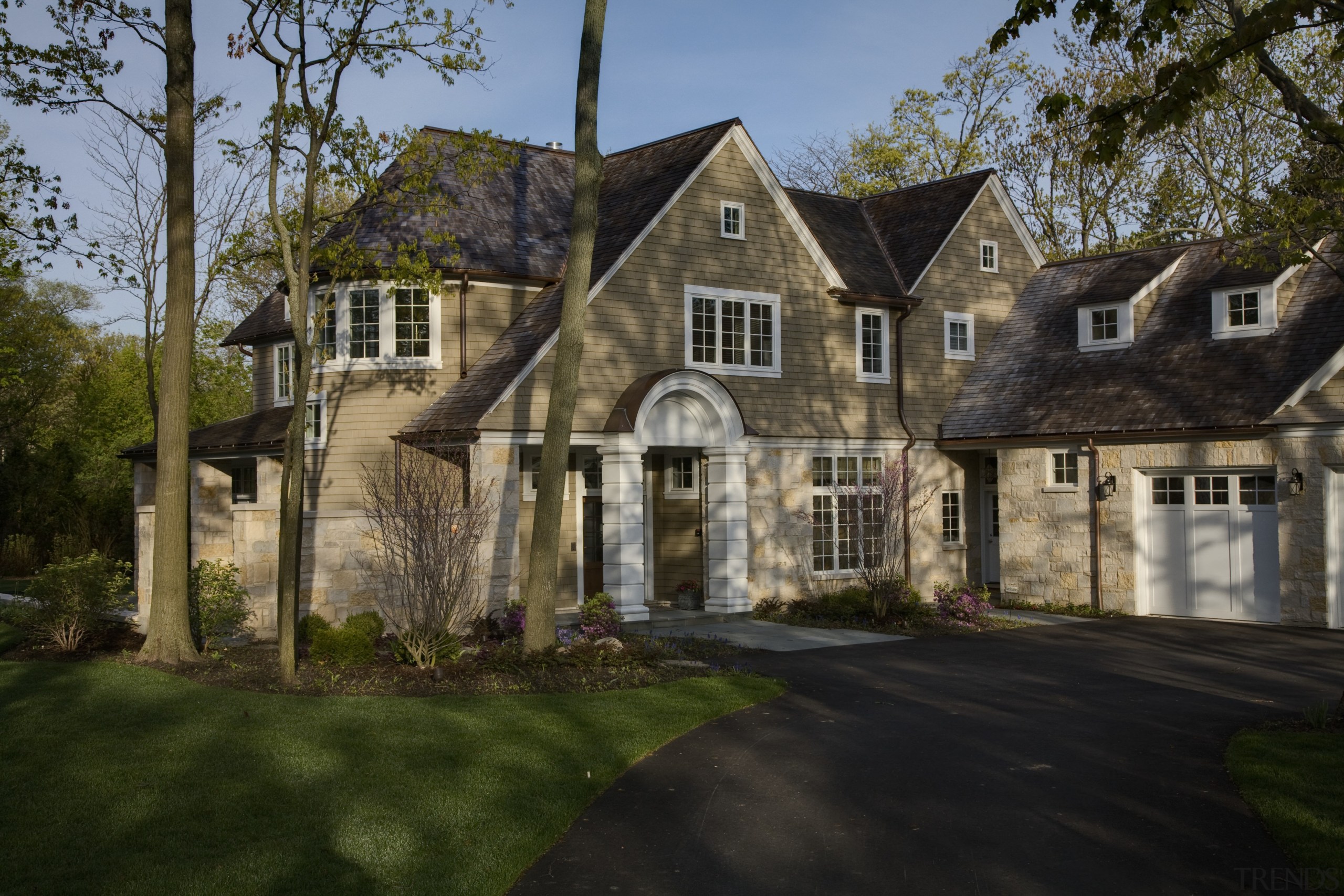 Exterior view of house featuring asymmetrical gabled roof building, cottage, estate, facade, farmhouse, home, house, landscape, mansion, neighbourhood, property, real estate, residential area, roof, siding, suburb, tree, window, brown, black