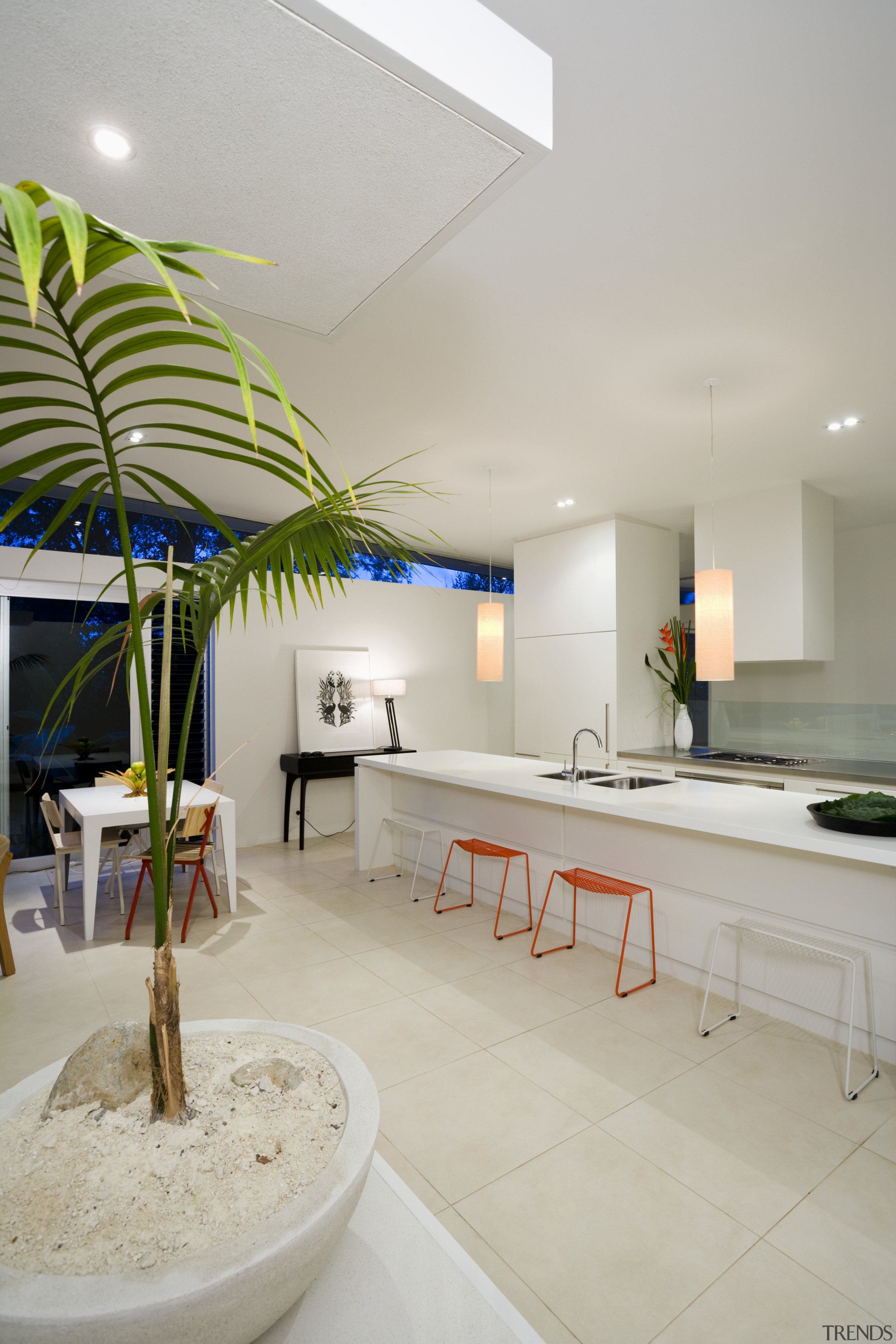 View of the kitchen with a long island architecture, bathroom, ceiling, daylighting, home, house, interior design, real estate, room, gray