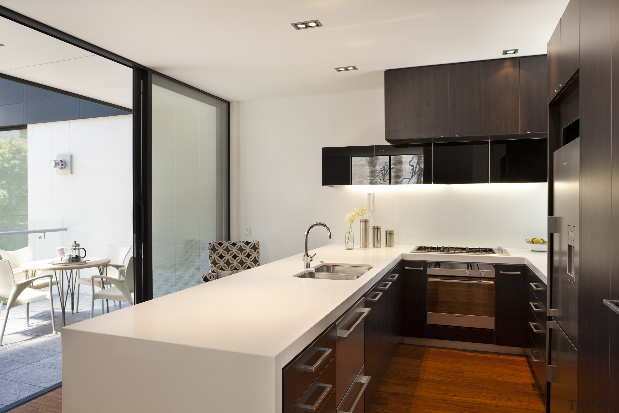 View of kitchen with white island, wooden flooring architecture, cabinetry, countertop, interior design, kitchen, real estate, room, white