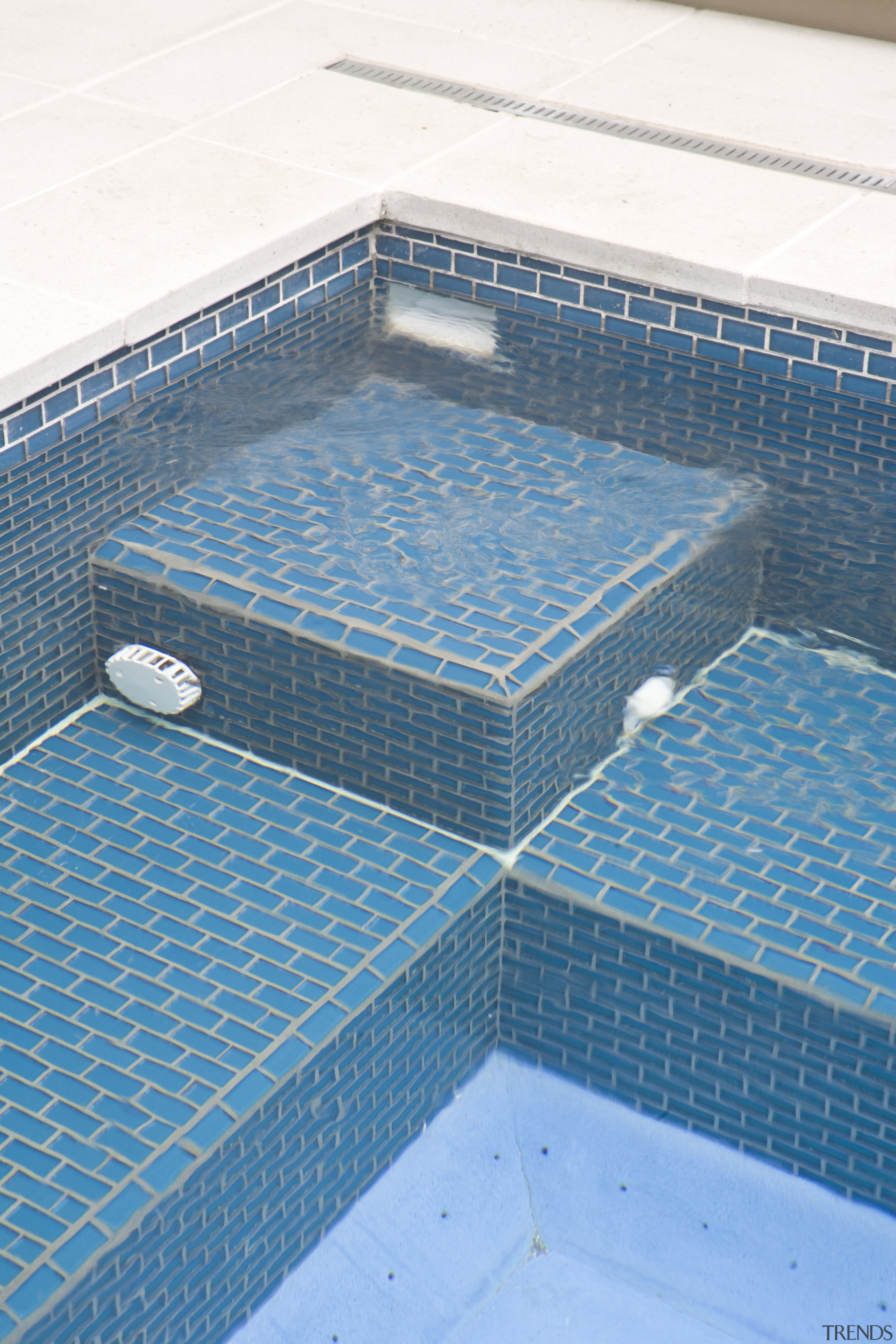 View of the pool tiling and paving. - angle, floor, net, product, swimming pool, tile, teal